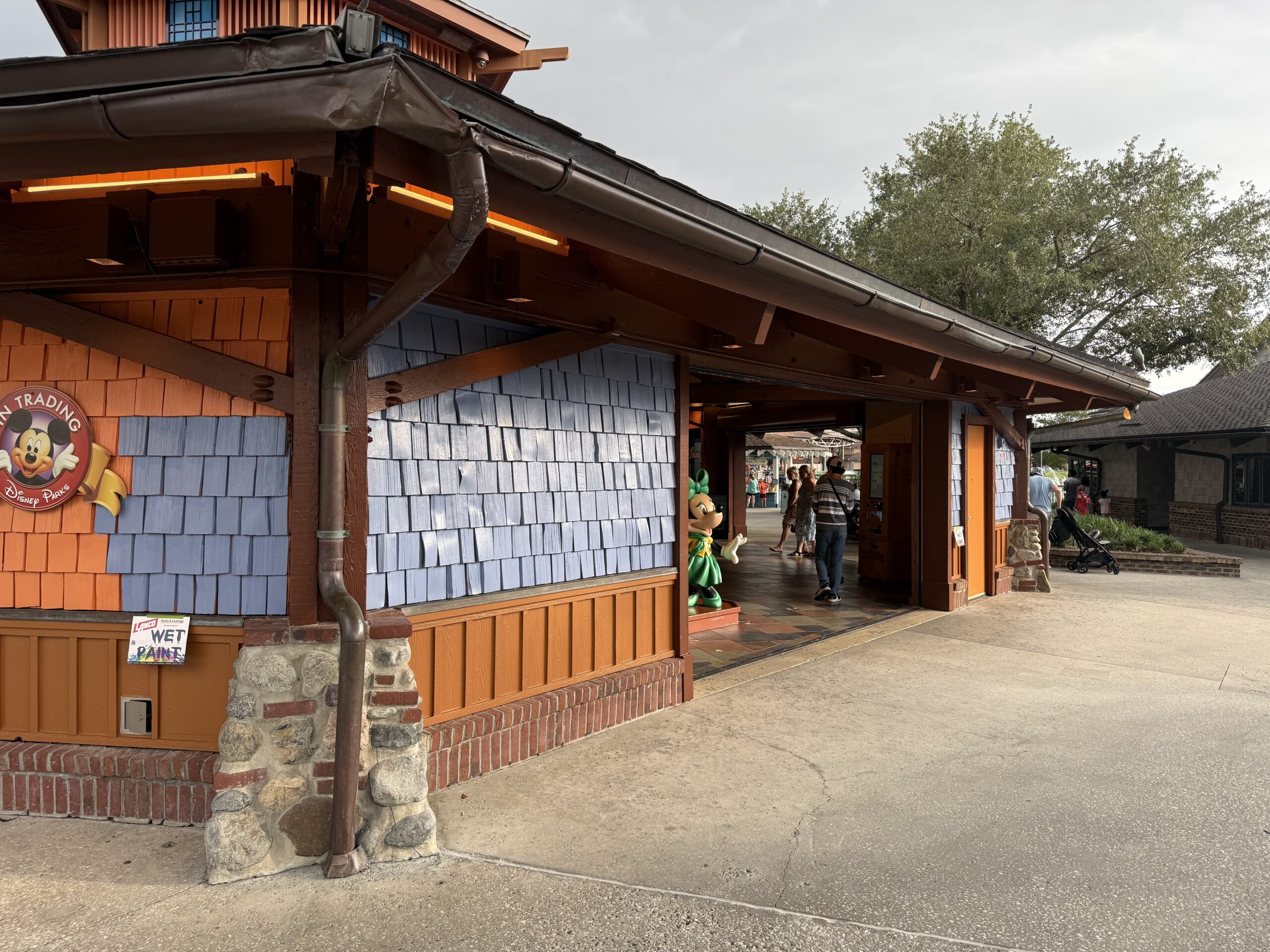 Pin Traders in Disney Springs is currently in the progress of being painted from an orange-brown to blue.