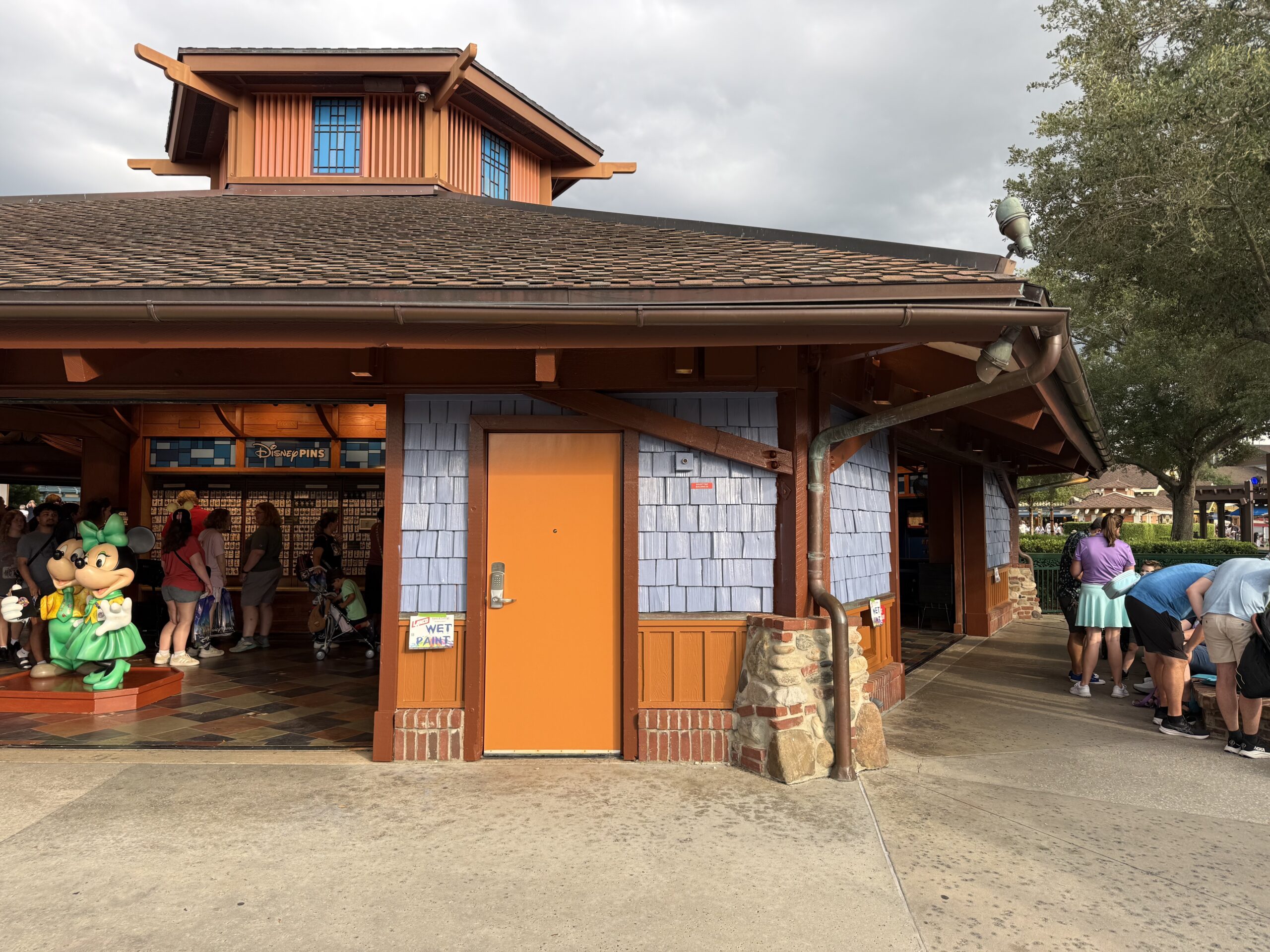 Pin Traders in Disney Springs is currently in the progress of being painted from an orange-brown to blue.