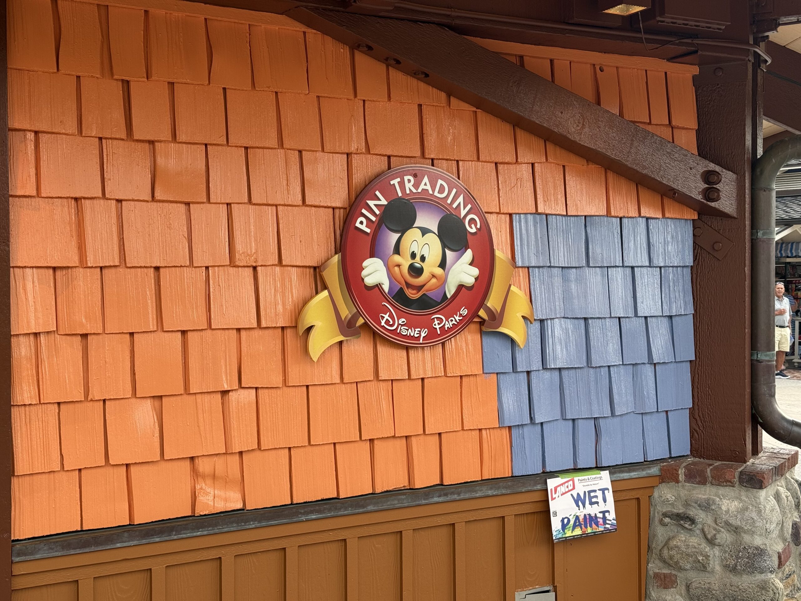 Pin Traders in Disney Springs is currently in the progress of being painted from an orange-brown to blue.