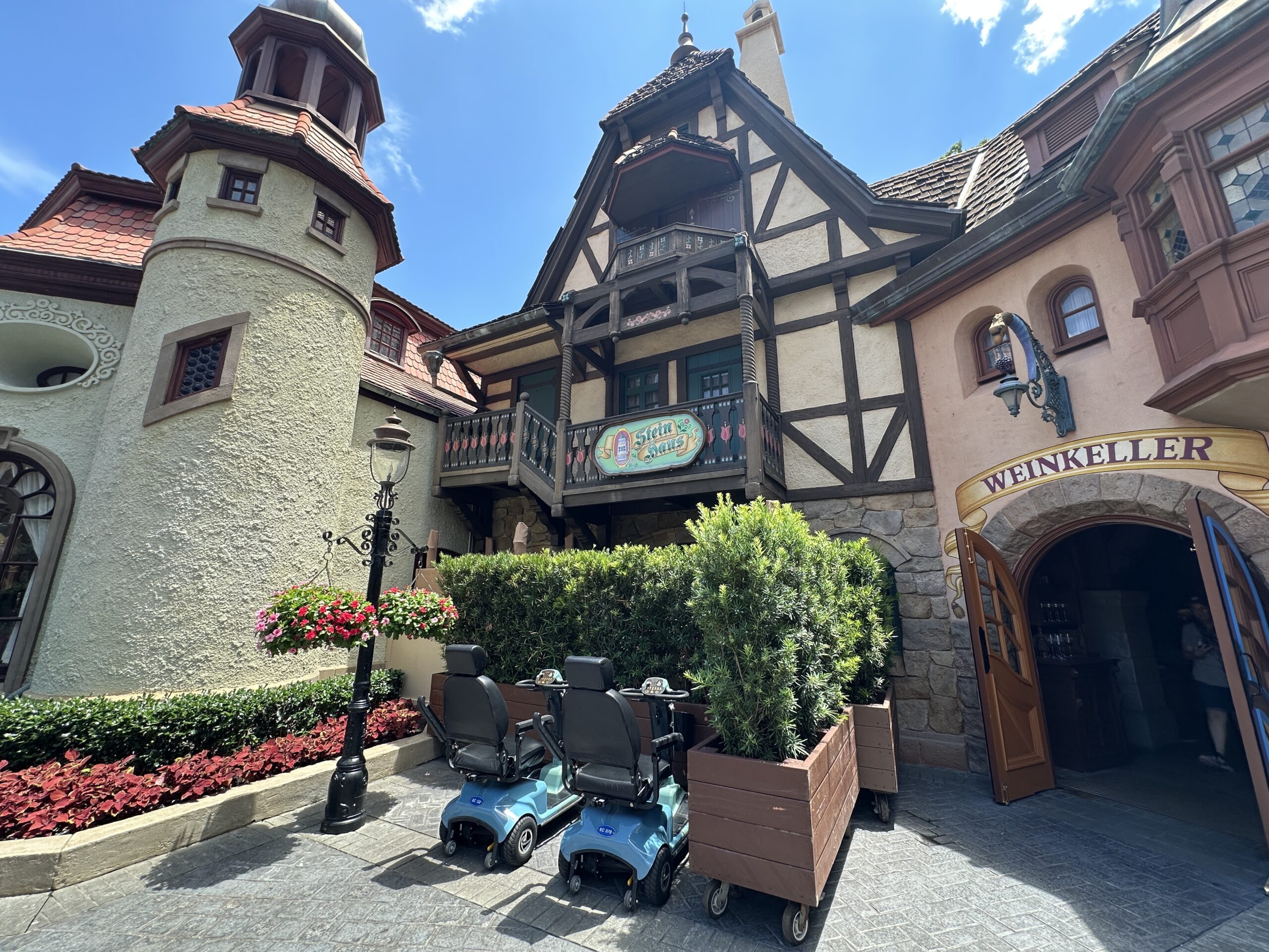 It looks like Disney is preparing for an exterior refurbishment of Stein Haus in the Germany Pavilion of EPCOT. Rolling planters, scrim, and scaffolding now block the shop's main entrance.