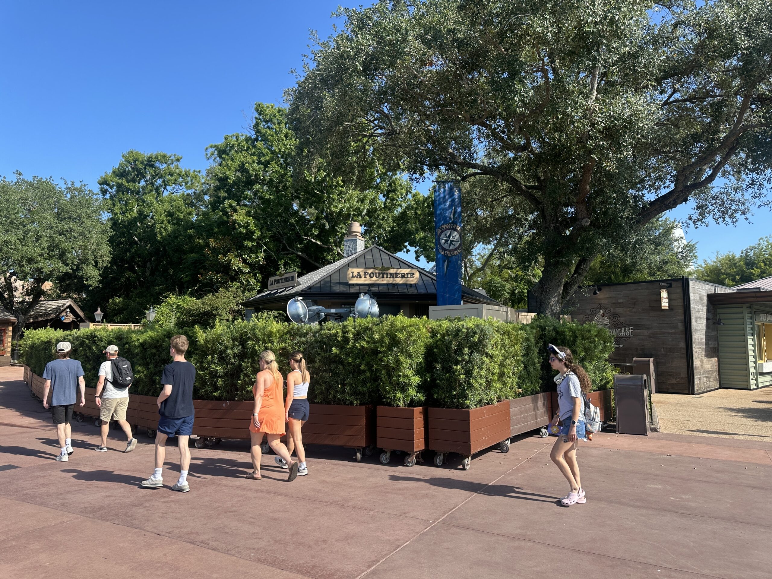 Set to open July 1, La Poutinerie at EPCOT now has the official name signage installed on the roof of the kiosk.