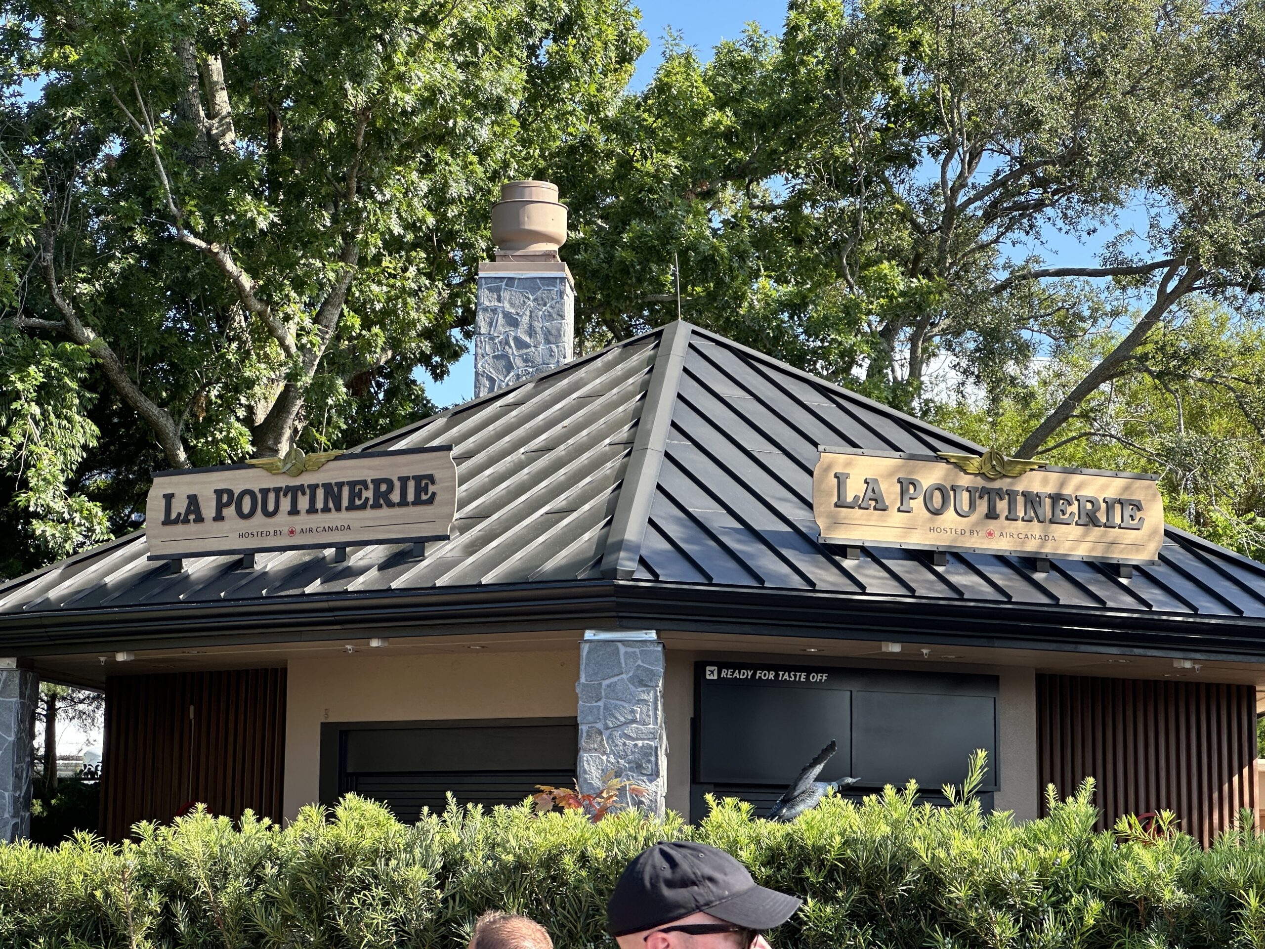 Set to open July 1, La Poutinerie at EPCOT now has the official name signage installed on the roof of the kiosk.