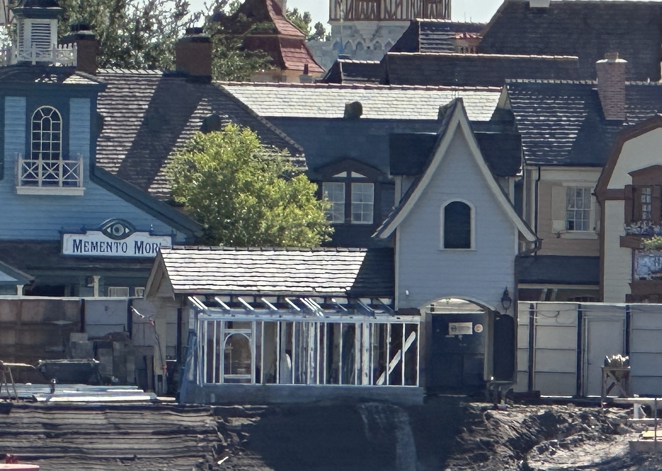 A building near The Haunted Mansion at Magic Kingdom is getting an extension, possibly related to construction of Piston Peak National Park.