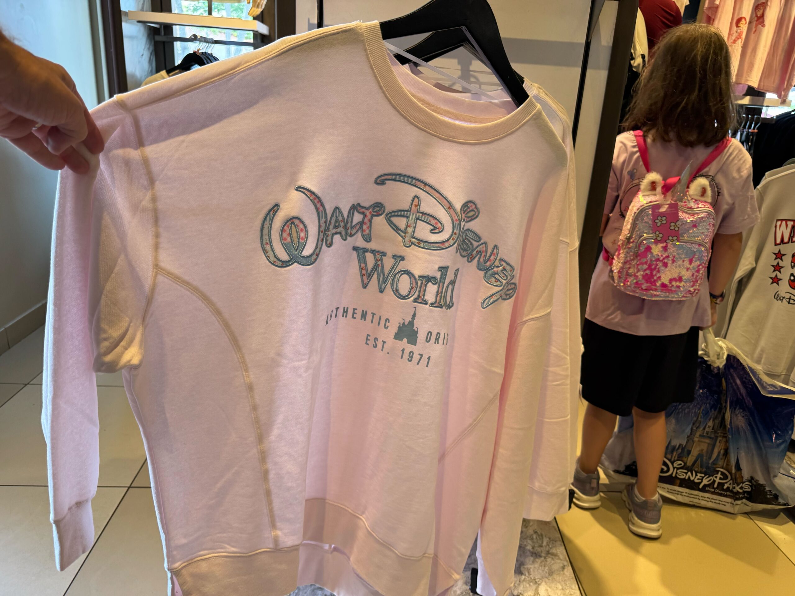 This pullover is the same as the one above, but the shirt itself is a very light pink color.