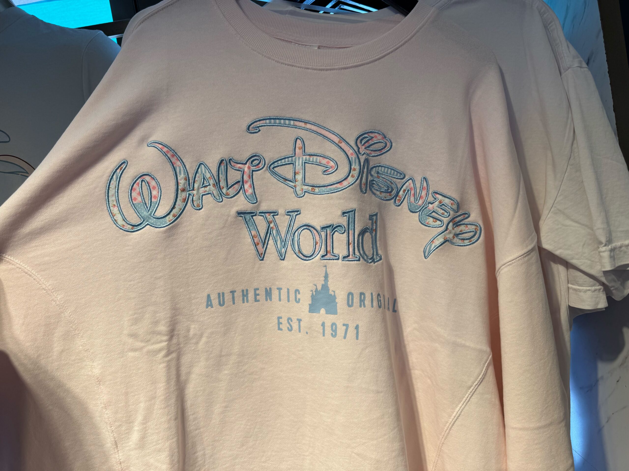 This pullover is the same as the one above, but the shirt itself is a very light pink color.