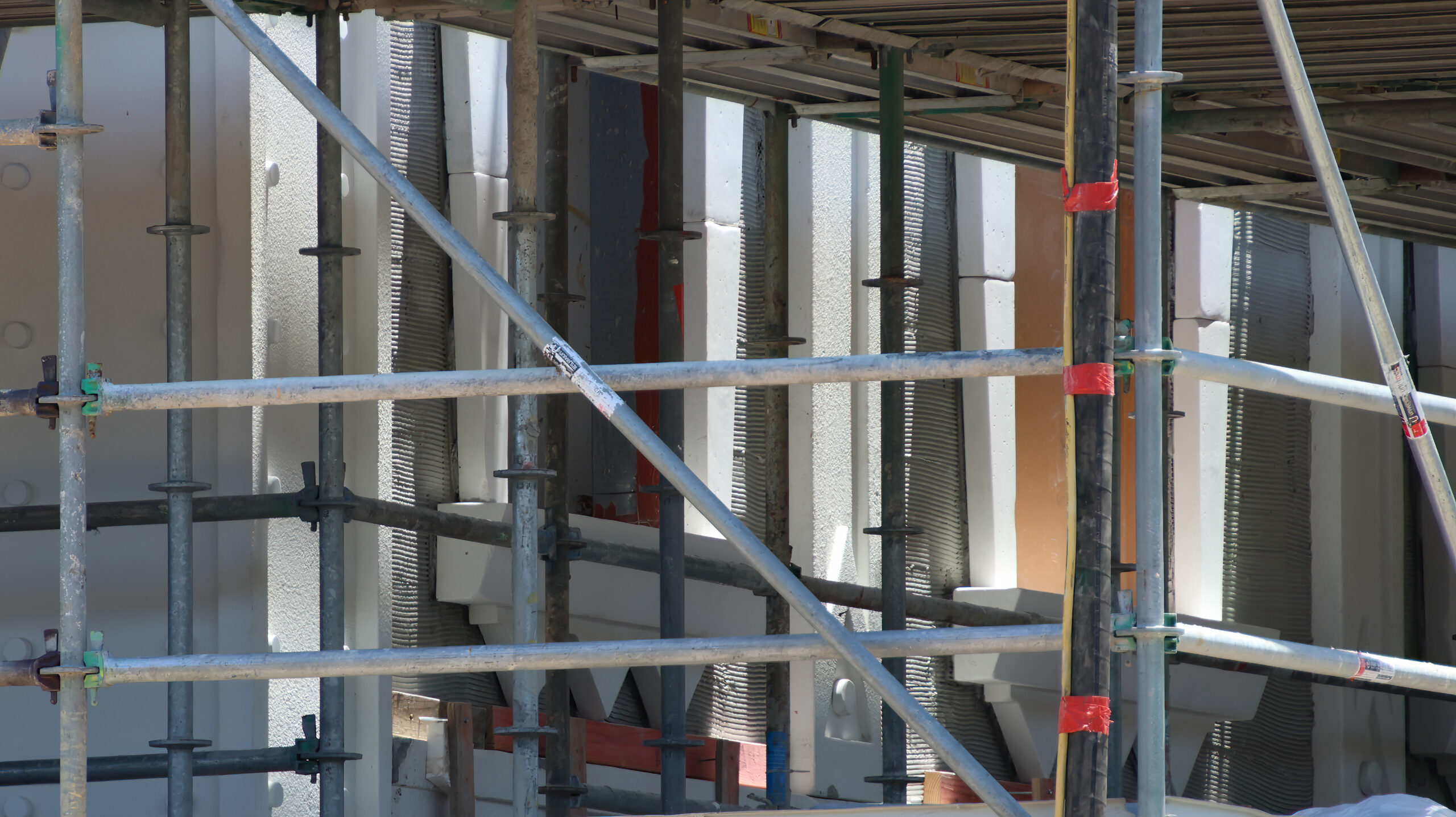 New close-up views reveal the monster-inspired details transforming buildings in the future Monstropolis land at Walt Disney World.