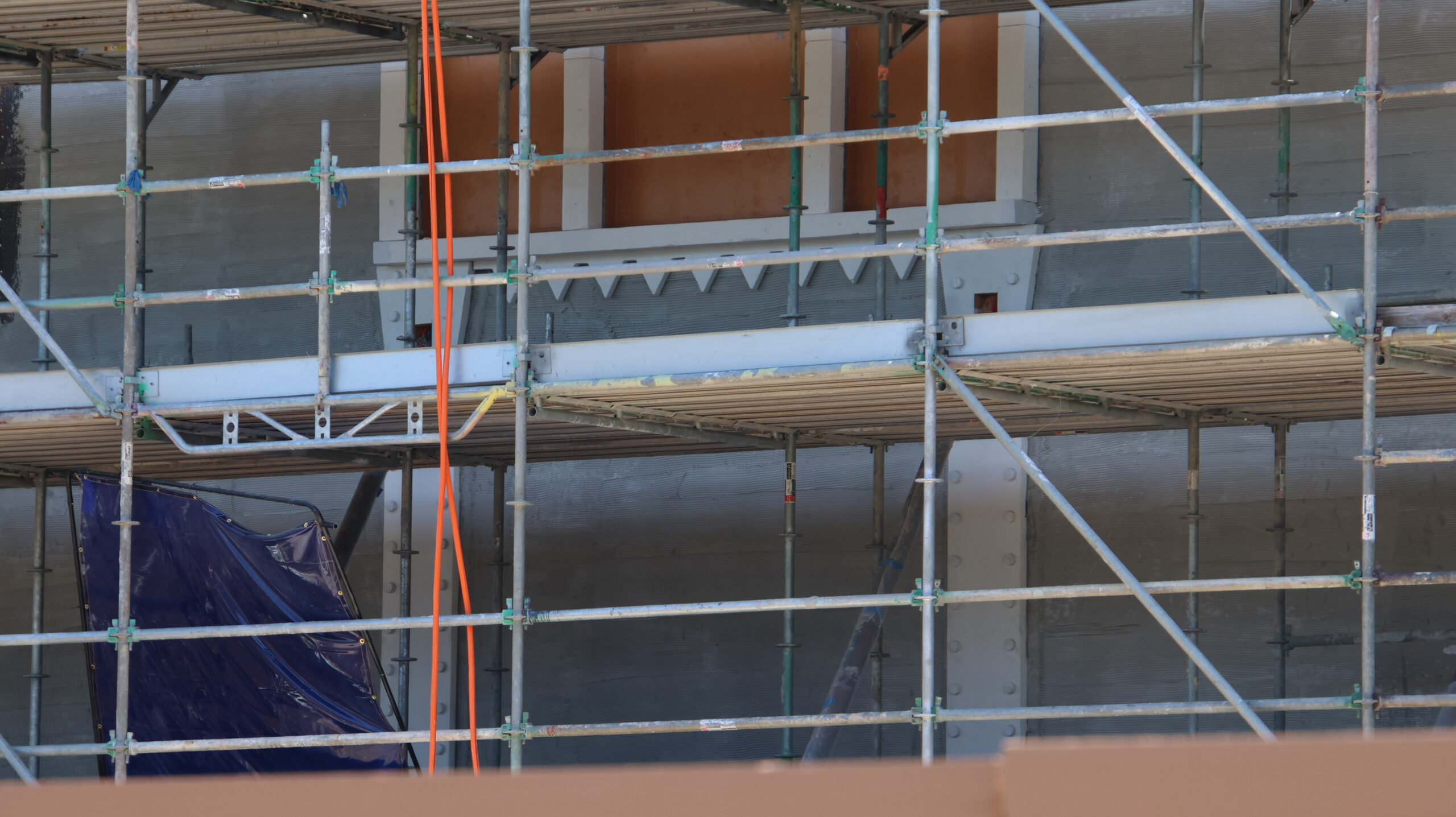New close-up views reveal the monster-inspired details transforming buildings in the future Monstropolis land at Walt Disney World.