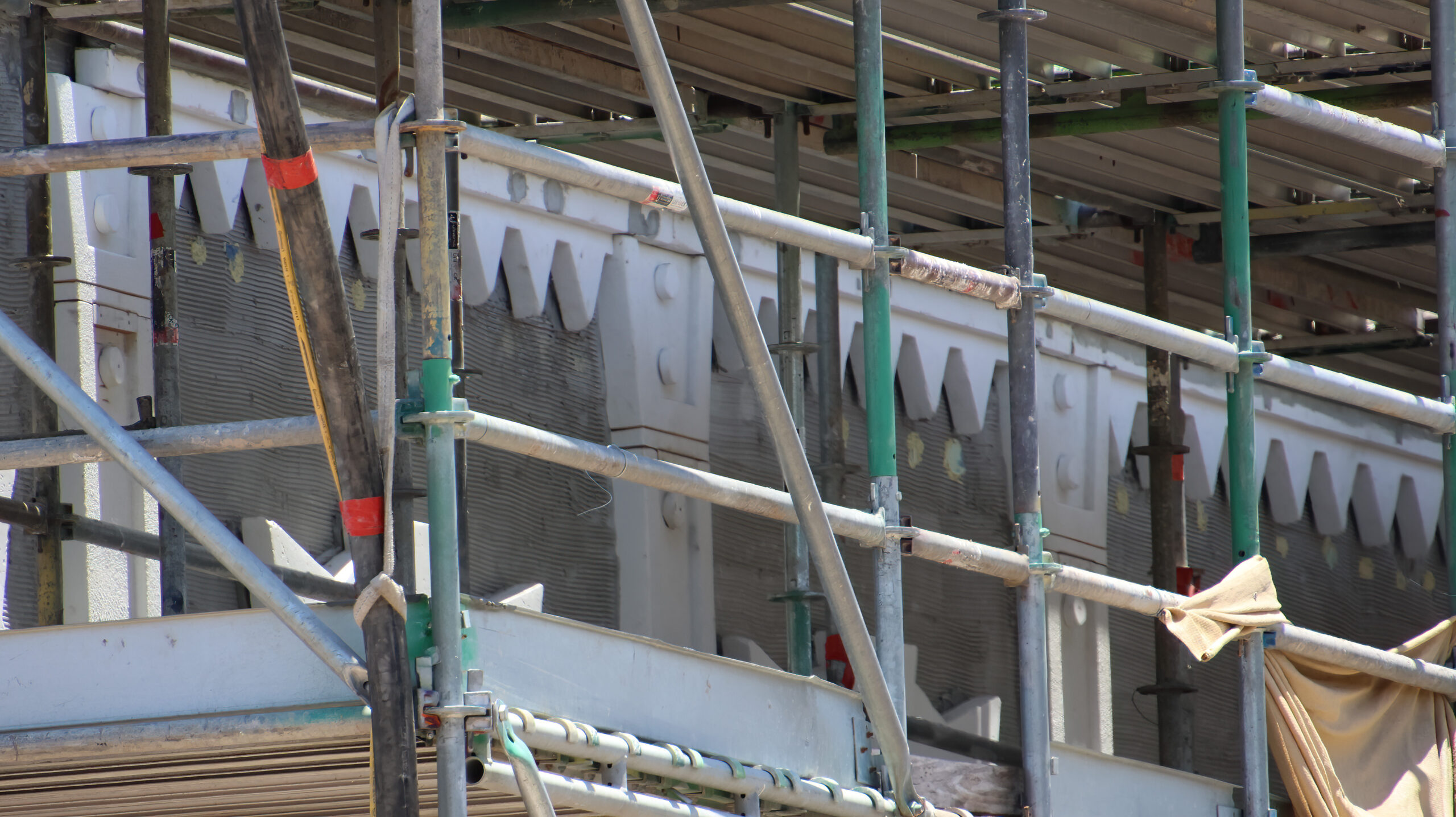 New close-up views reveal the monster-inspired details transforming buildings in the future Monstropolis land at Walt Disney World.
