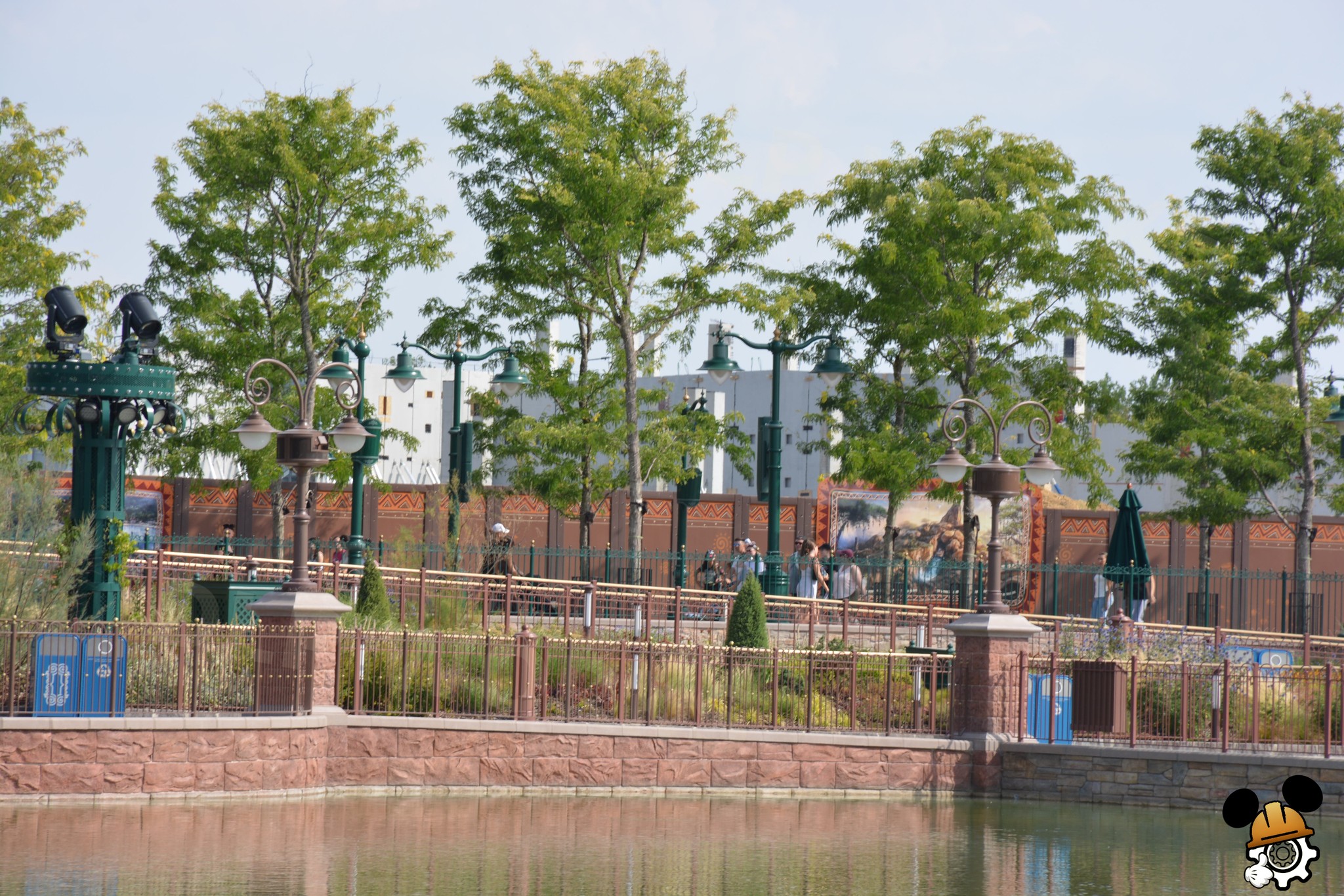 Vertical concrete columns extend beyond the current height of the walls, while exposed reinforcing steel remains visible across the top of several sections. These elements will allow additional levels and structural components to be added as work progresses.