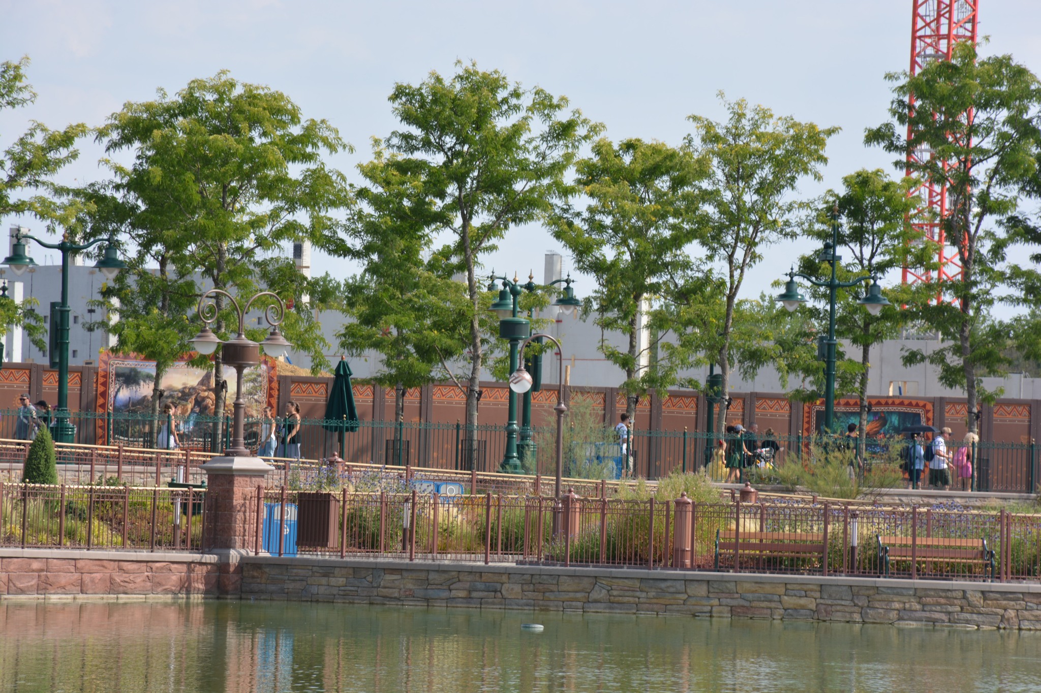 Vertical concrete columns extend beyond the current height of the walls, while exposed reinforcing steel remains visible across the top of several sections. These elements will allow additional levels and structural components to be added as work progresses.