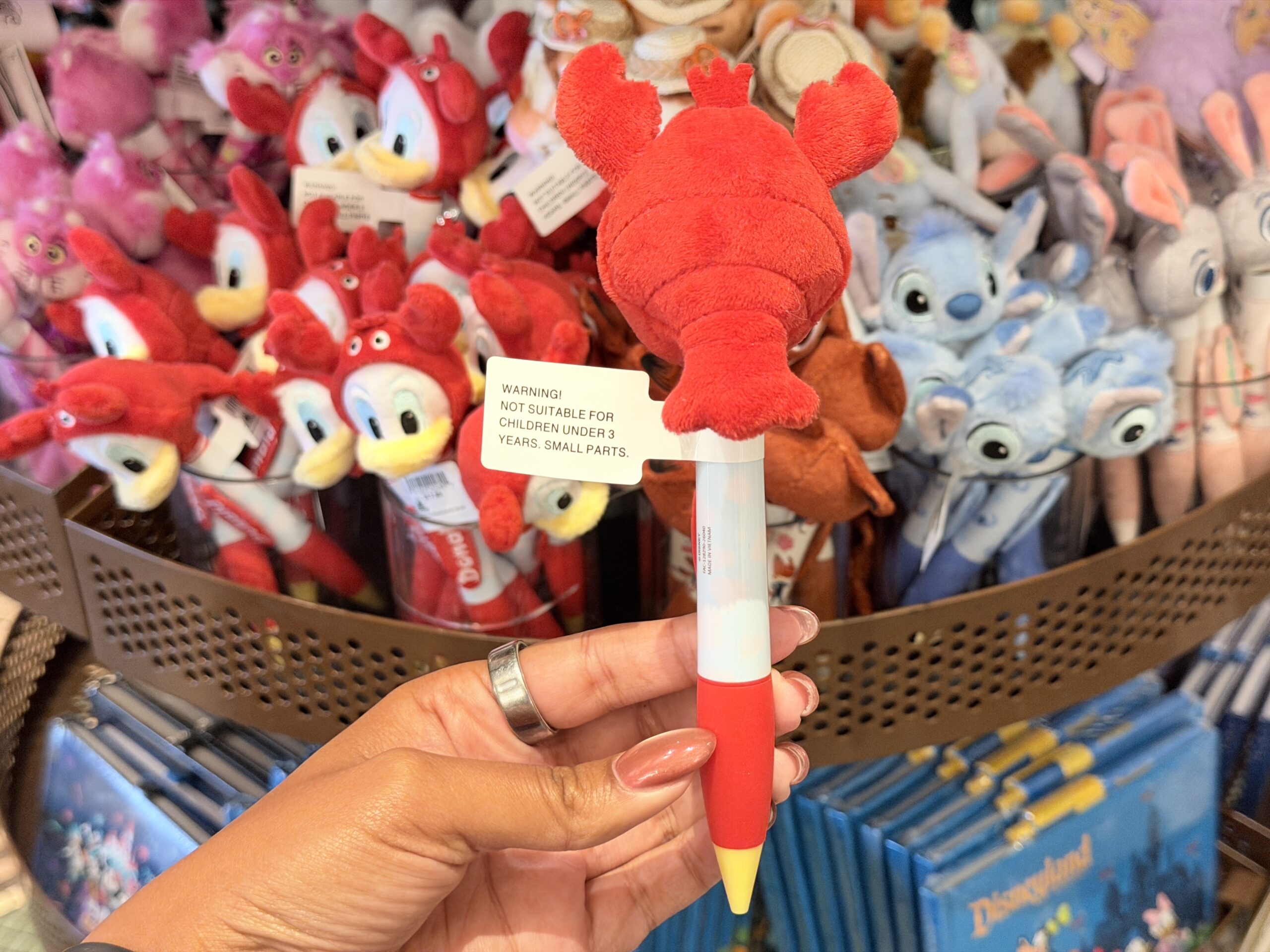 The pen barrel is red and white, with Donald’s name printed vertically on a red nameplate. A yellow pen tip completes the look.