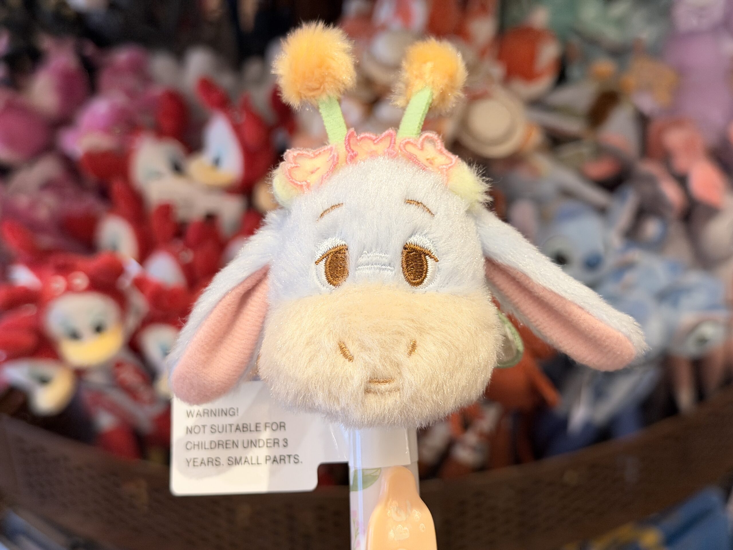 The pen barrel is pastel blue and lavender, with an orange nameplate reading “Eeyore.” The overall design gives Eeyore a bright seasonal look, evocative of a honeybee, despite his usually melancholy personality.