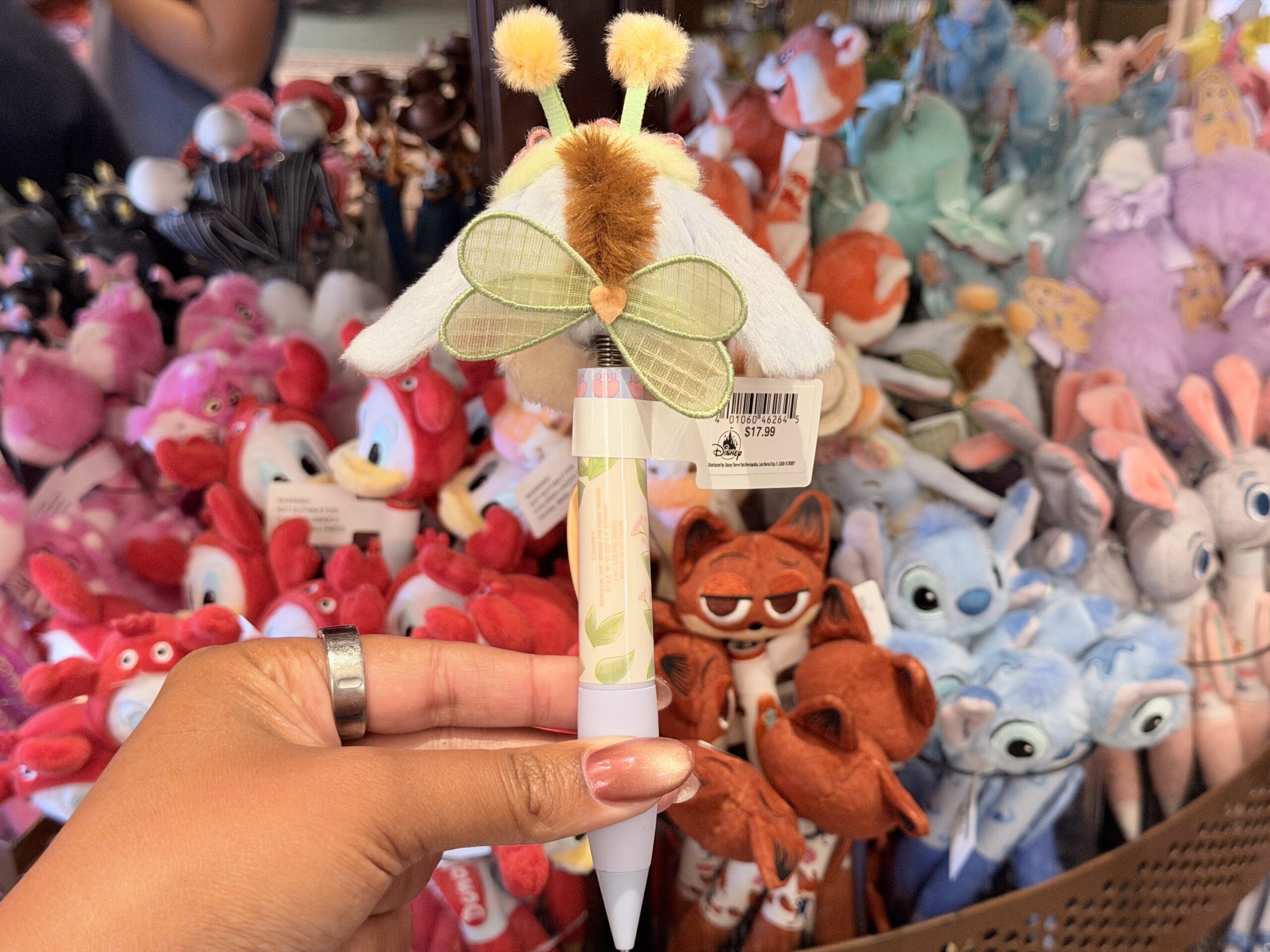The pen barrel is pastel blue and lavender, with an orange nameplate reading “Eeyore.” The overall design gives Eeyore a bright seasonal look, evocative of a honeybee, despite his usually melancholy personality.