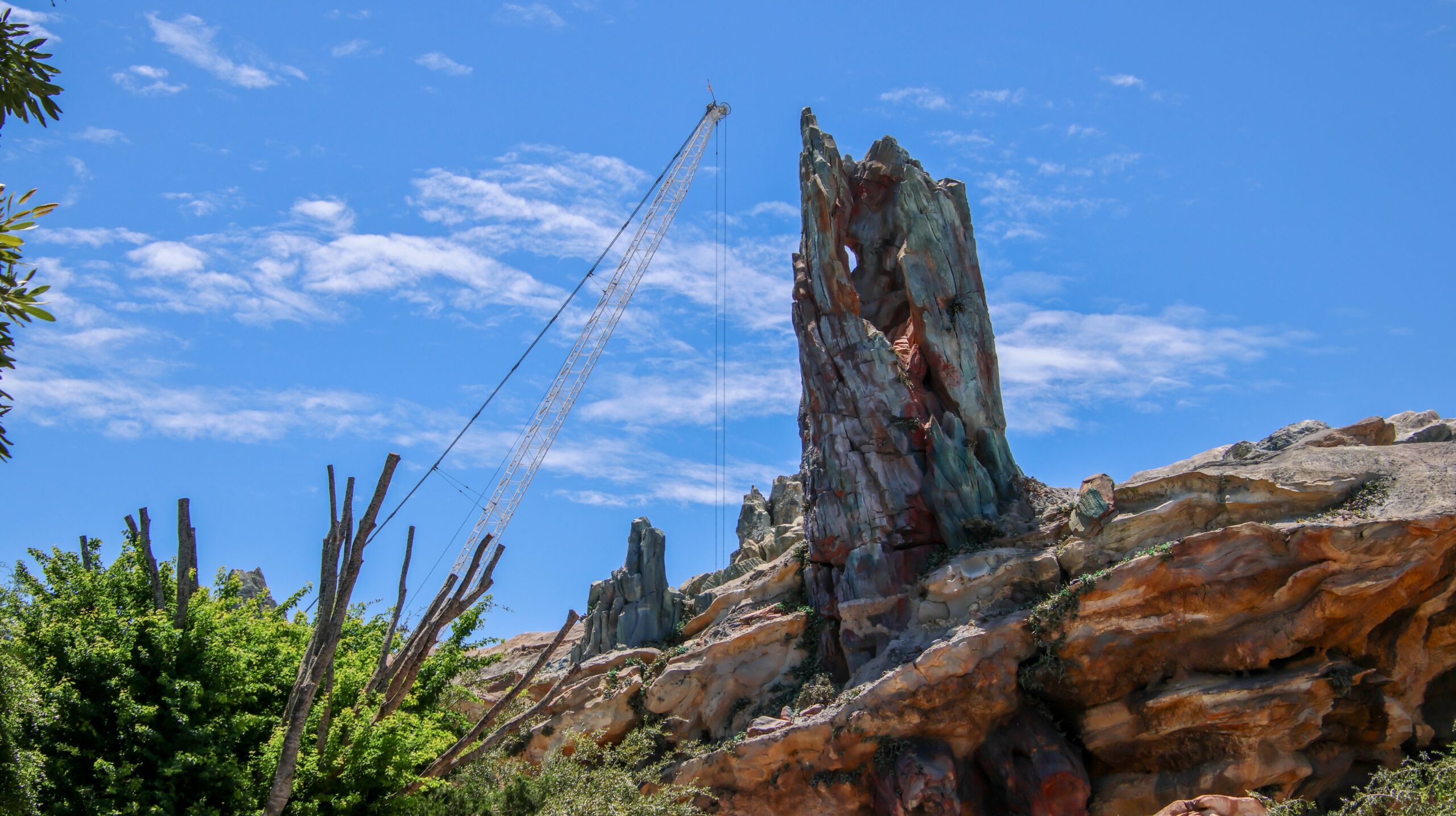 Construction of the upcoming Monsters, Inc. roller coaster continues to reshape the skyline of Disney’s Hollywood Studios, with a towering crane now visible from other areas of the park.