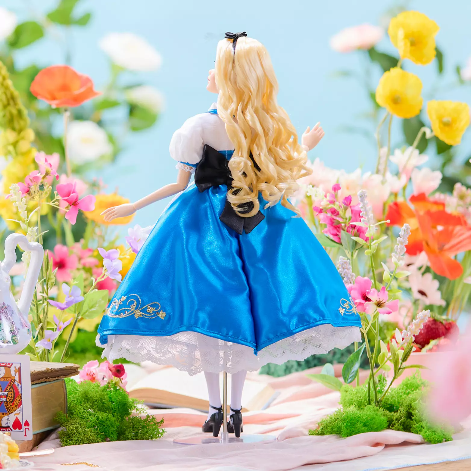 The doll also has a display stand, as seen above.