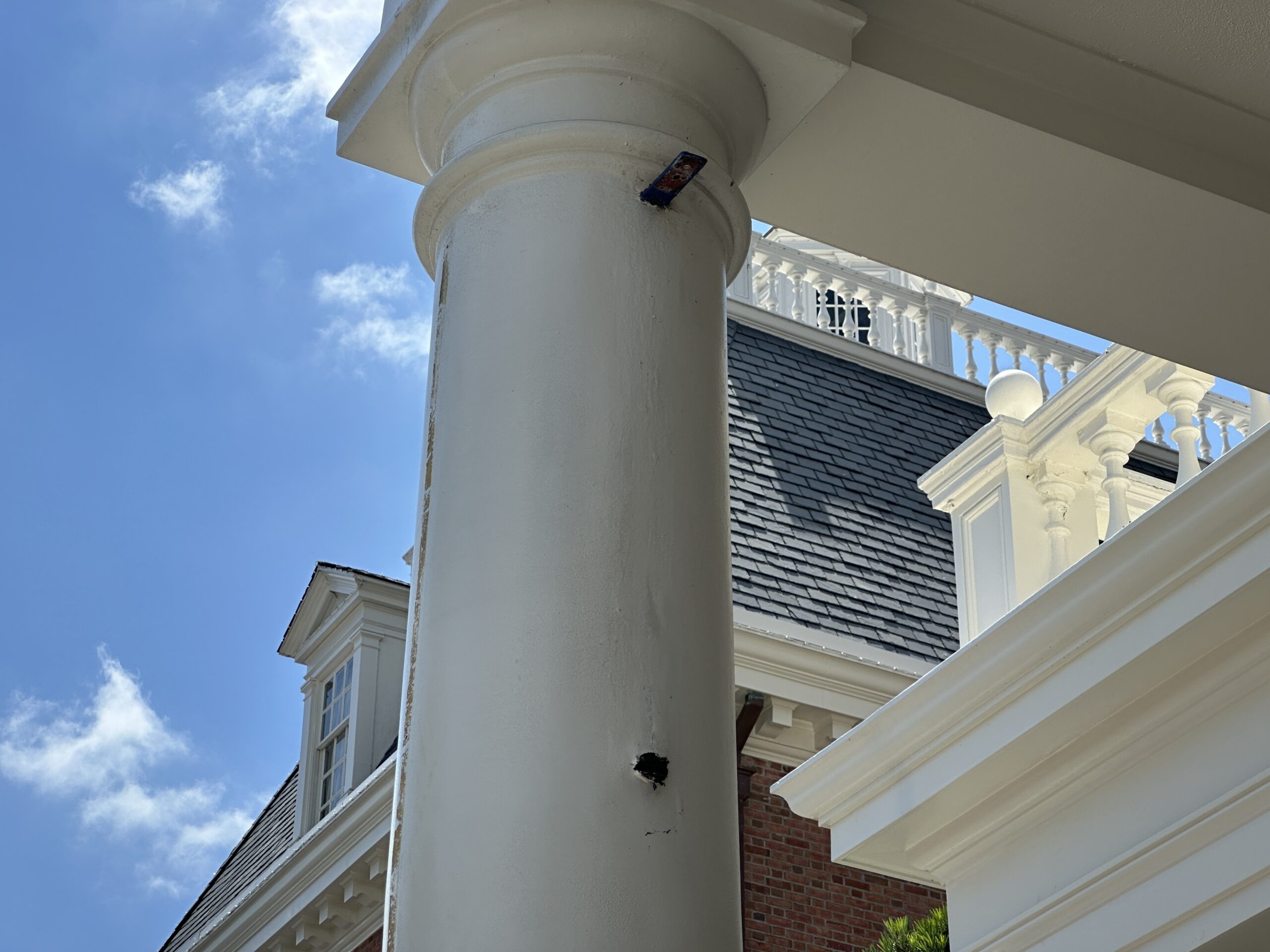 It appears that during the sign removal, at least one of the brackets broke off of the column, as seen above. The bottom bracket is missing, and there is just a hole where it used to be.