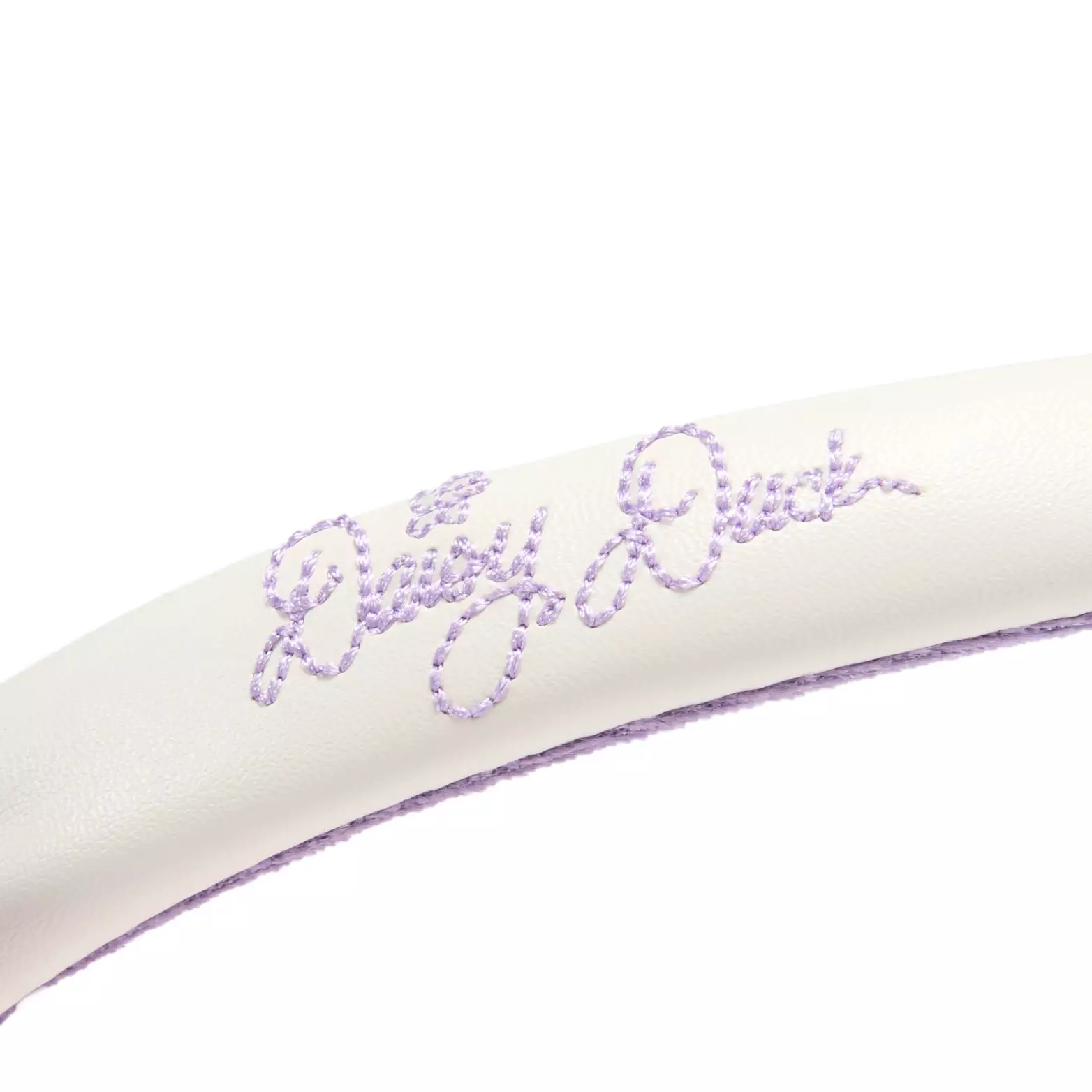 Daisy’s autograph is embroidered in purple on the side of the headband.