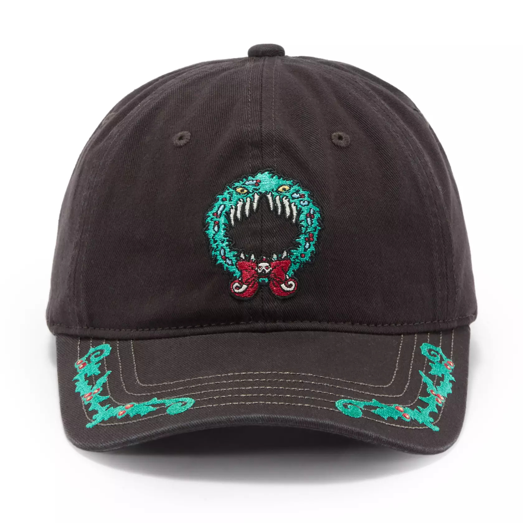 This ball cap is inspired by Haunted Mansion Holiday, Disneyland's seasonal overlay for The Haunted Mansion featuring The Nightmare Before Christmas characters. A holiday wreath with teeth and yellow eyes is embroidered on the front of the black ball cap. Garland trims the edges of the curved brim.
