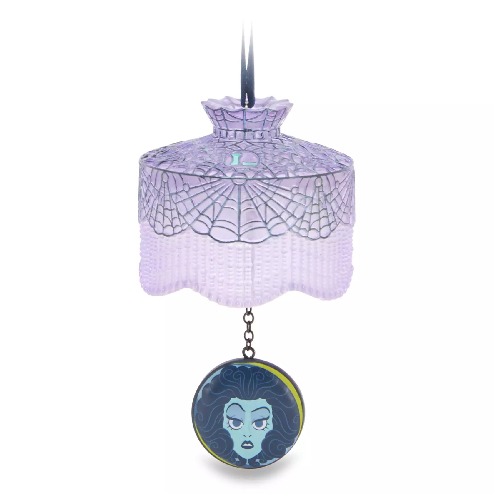 The Madame Leota ornament depicts her face in her crystal ball dangling by a chain from a purple translucent art nouveau lampshade. Spiderweb patterns are across the lampshade.