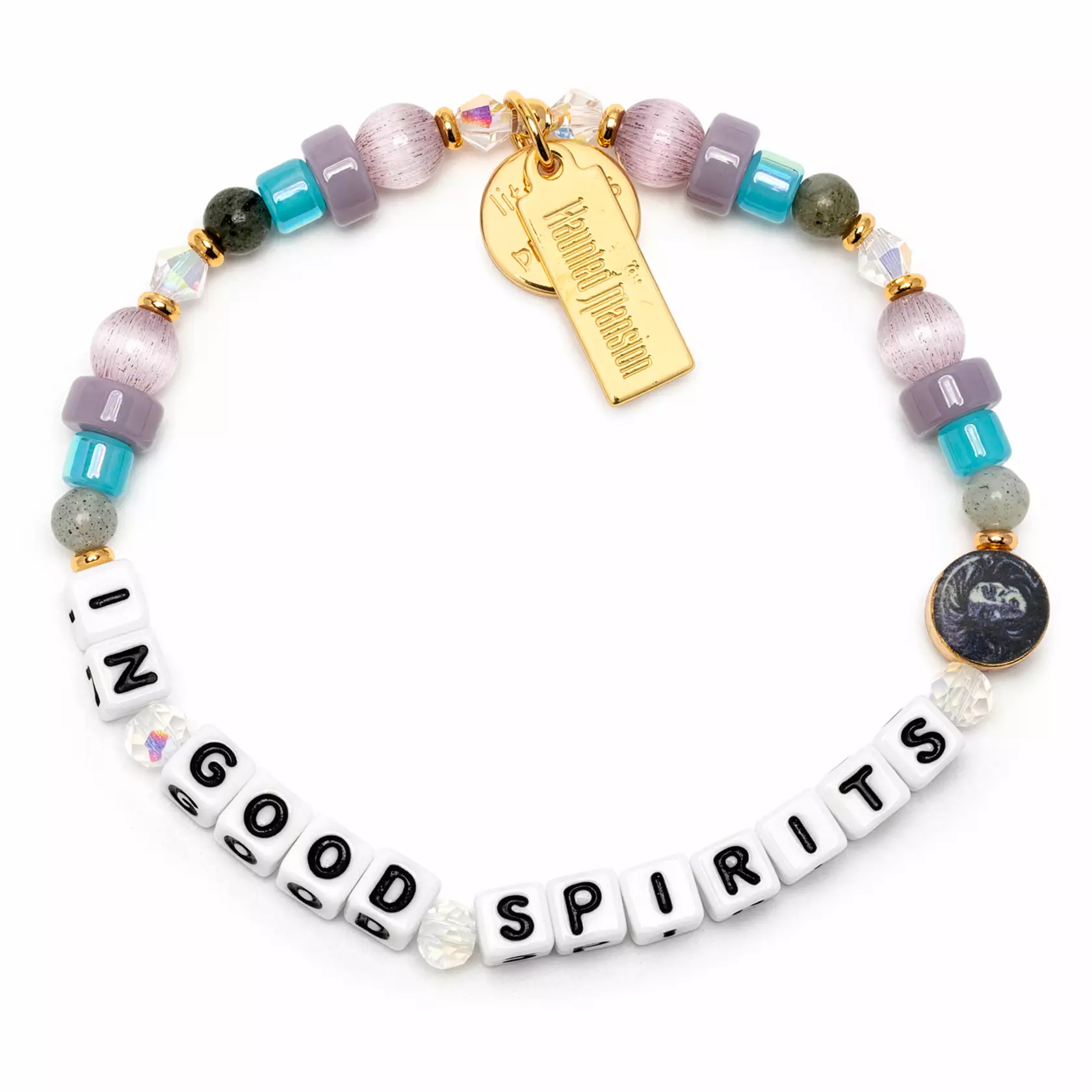 The bracelet consists of shiny blue, purple, and ghostly green beads. "In Good Spirits" is spelled out with letter beads. It has a goldtone "The Haunted Mansion" charm and a Madame Leota bead.