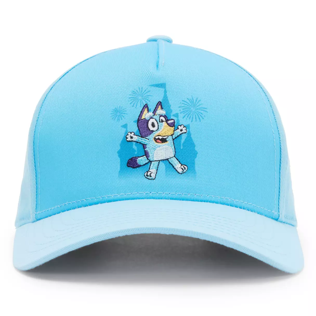This light blue baseball cap has a patch of Bluey jumping for joy on the front. Behind her is a Fantasyland Castle in a darker blue surrounded by exploding fireworks.