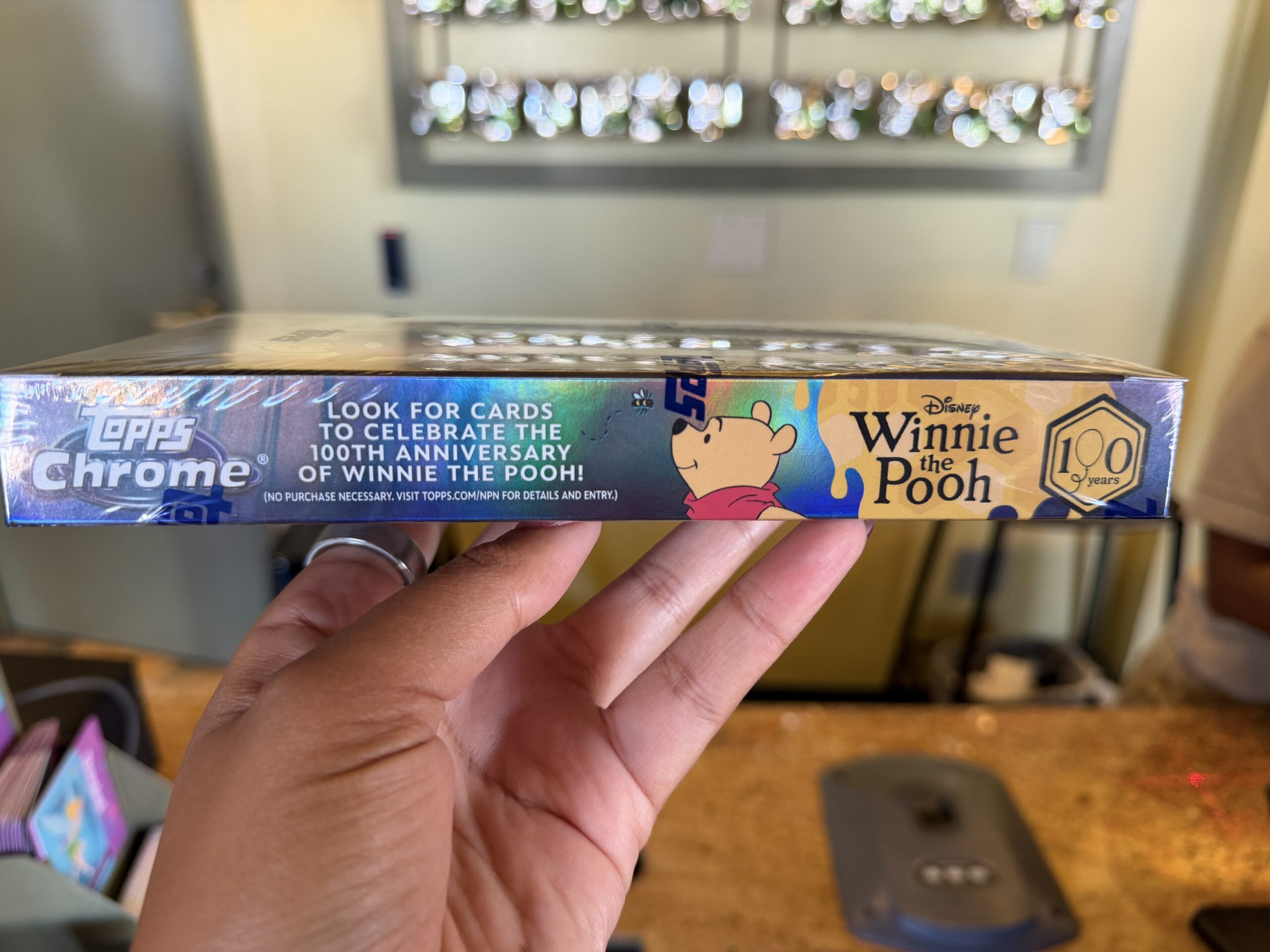 New Topps Chrome sets at Disneyland features cards from Toy Story, Moana, High School Musical, and more.
