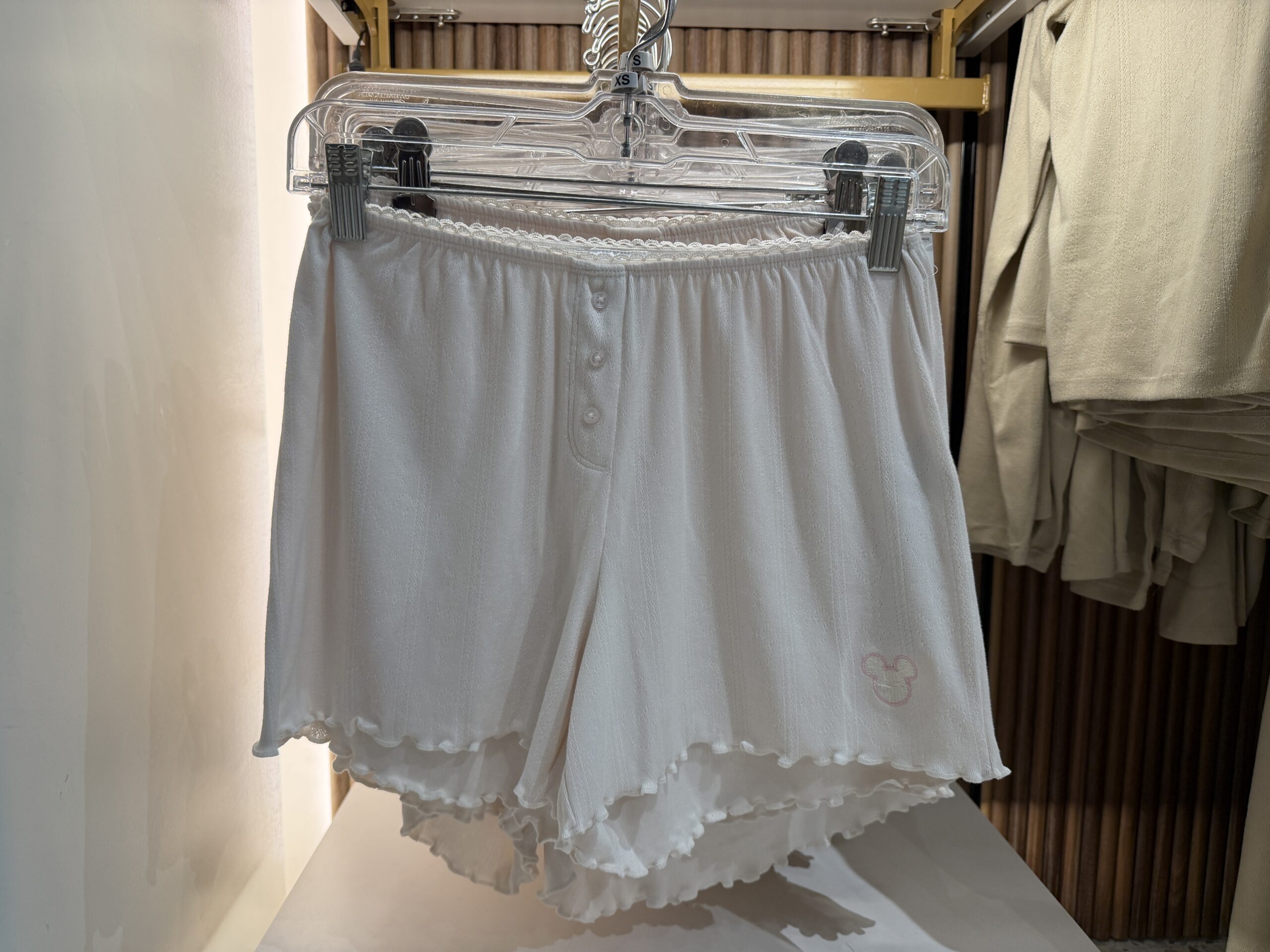 Made from the same material as the sets above, this is a pair of shorts. They are white with a Mickey head icon near the left thigh.