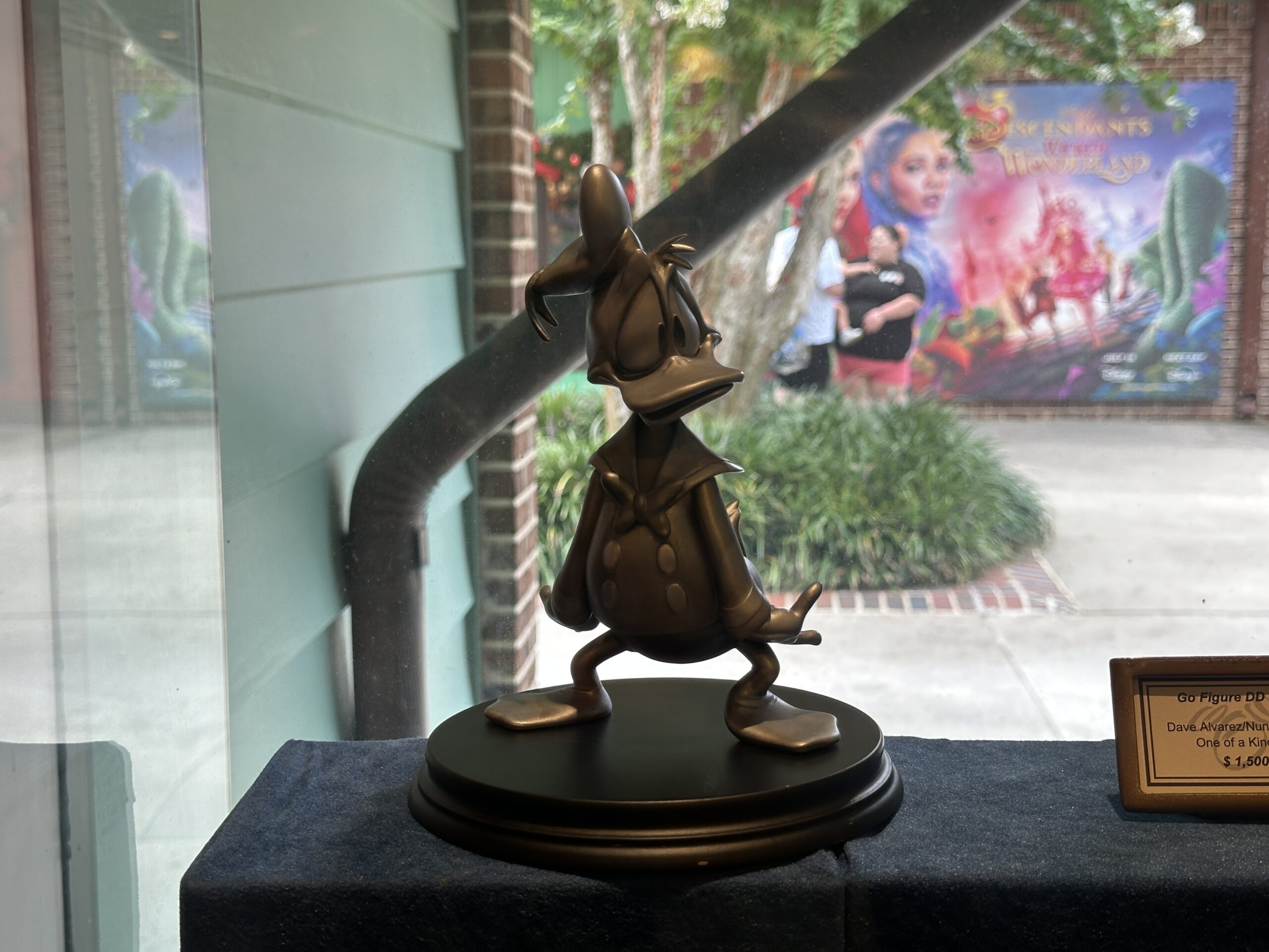 Cast in silver, this one-of-a-kind art piece by Dave Alvarez and Nuno Martins shows Donald Duck with a seemingly large bump on his head. He is wearing his classic sailor uniform.