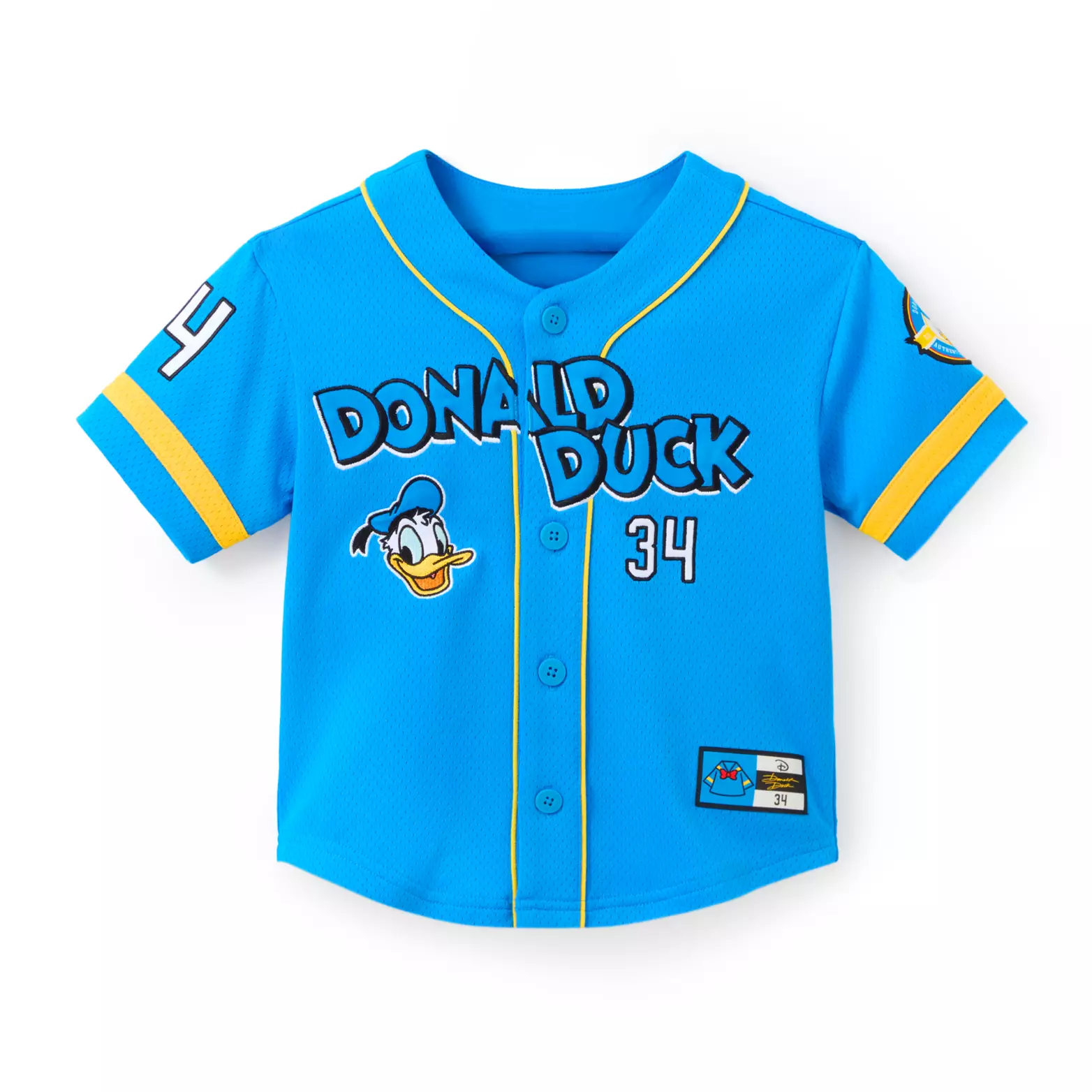 Continuing with the Donald and Daisy apparel, one of the newest baseball-style jerseys is inspired by Donald. It’s blue mesh with yellow trim and piping. "Donald Duck" across the front on an embroidered appliqué. Below the text is Donald’s face and “1934,” the year Donald was created.