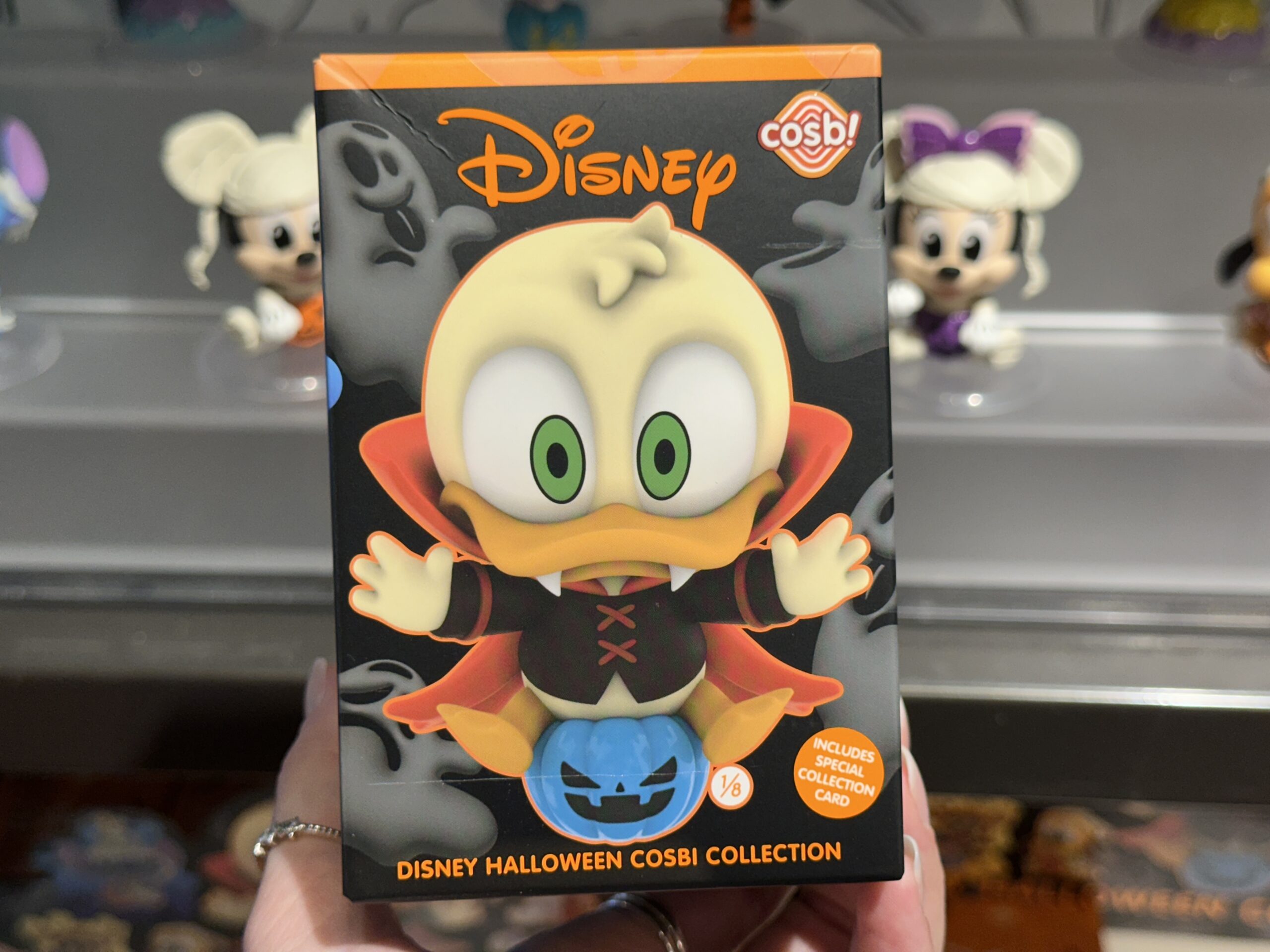 The front of the box has an image of Donald as a vampire figure. That is the mystery figure in the collection. Each box contains one figure.