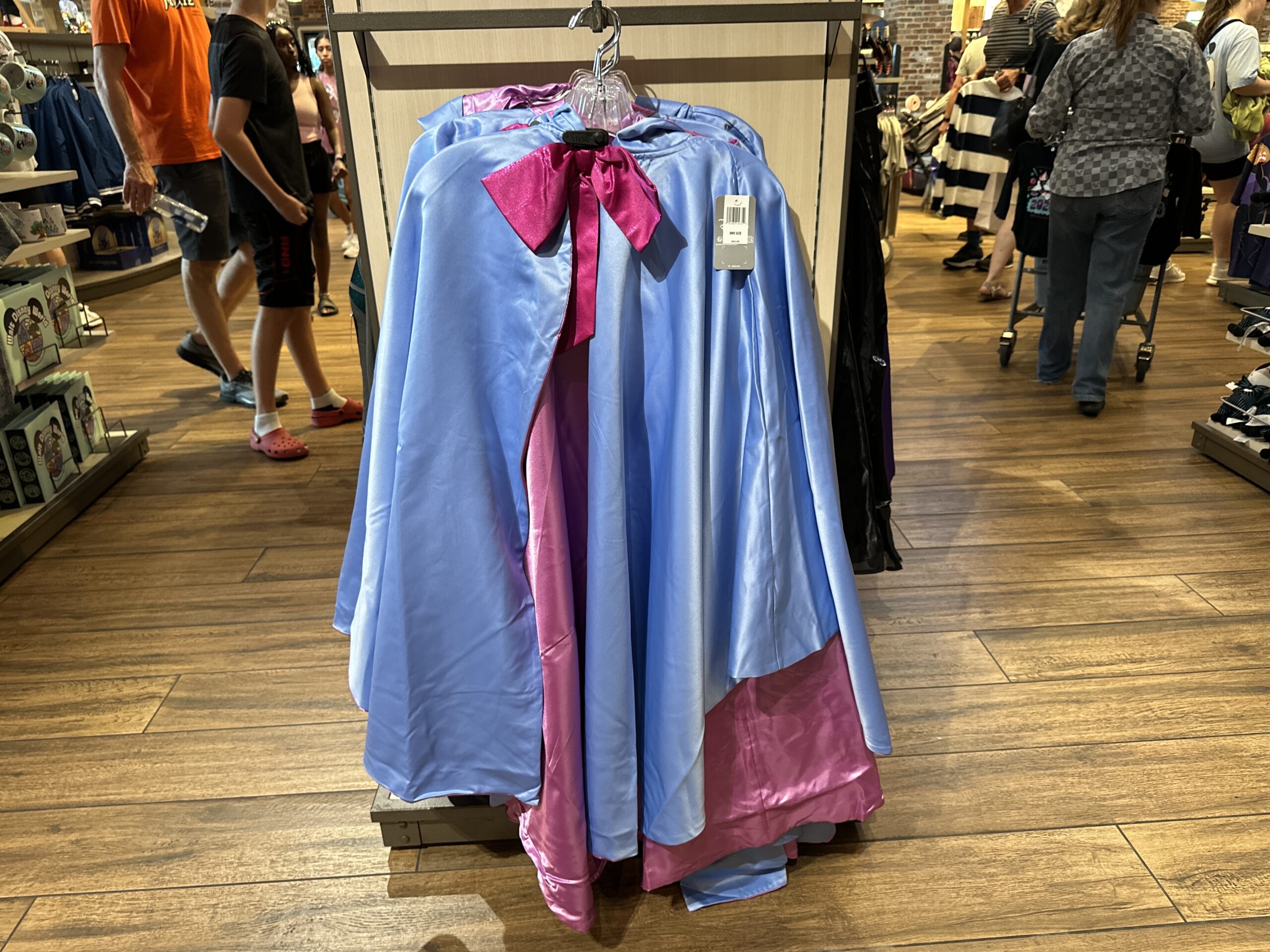 In shimmery blues and pinks, this cape will turn you into the Fairy Godmother from Cinderella. It ties together with a bright pink bow.