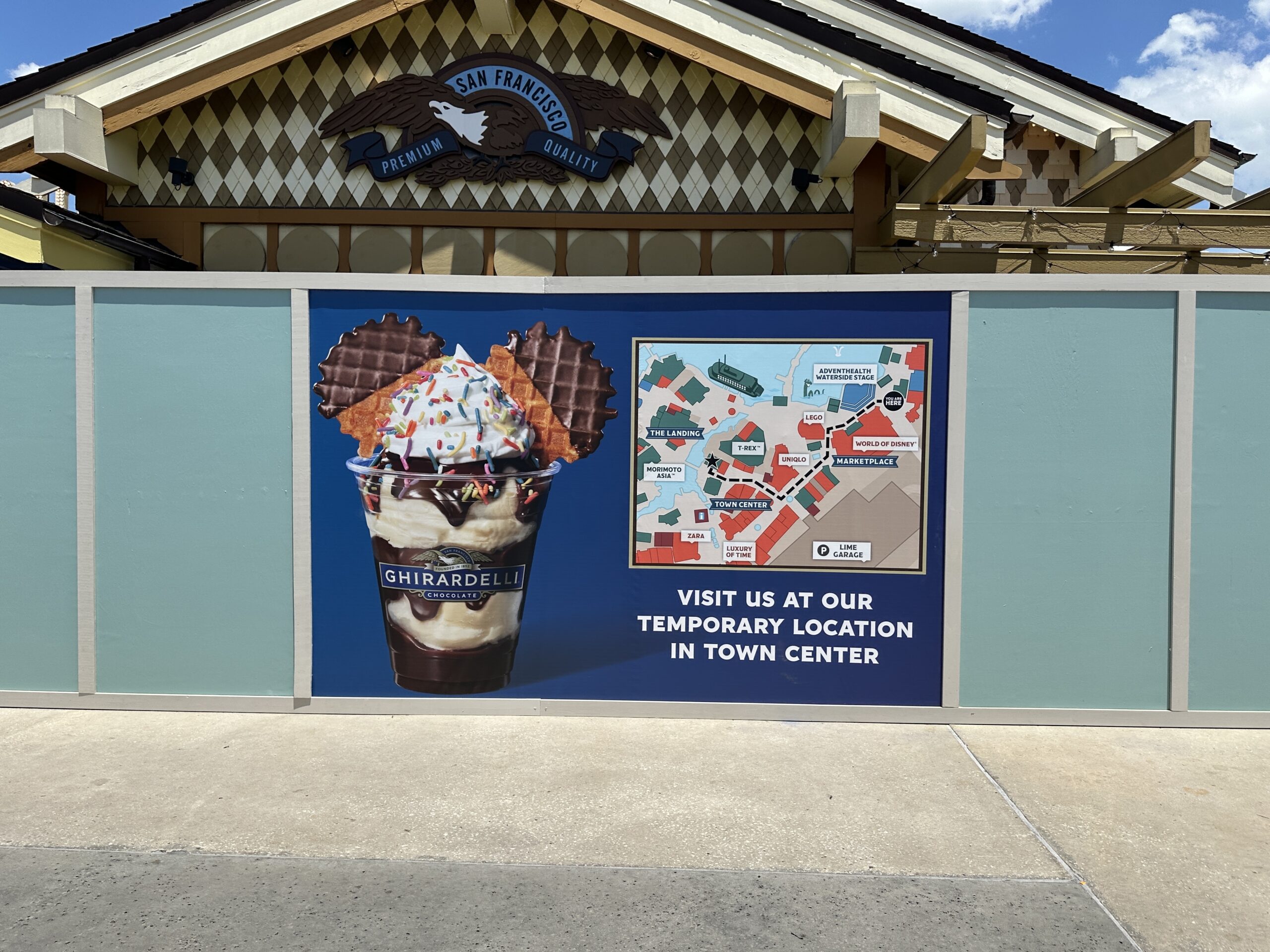 Ghiradelli Soda Fountain & Chocolate Shop is currently closed for refurbishment at Disney Springs. Aqua walls are now around the building.