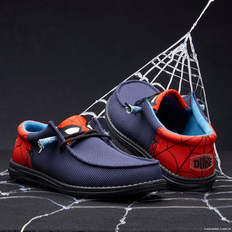 This shoe is mostly dark blue with red on the tongue and heel. The tongue features Spidey's iconic mask eyes while a web print is across the heel.