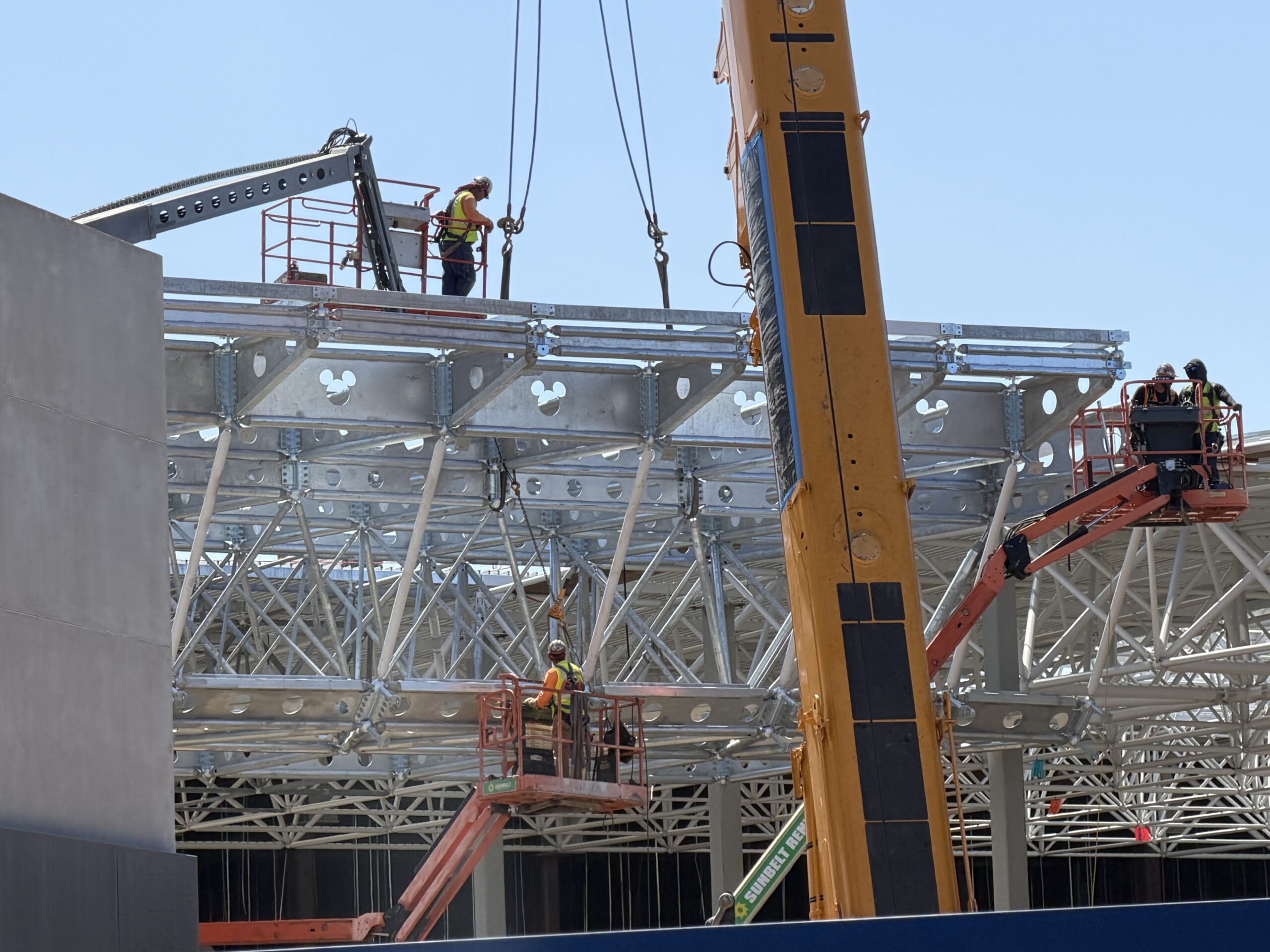 The beams facing outward that were being installed today showed hidden Mickeys cleverly placed in the center of each of them, peeking out from between the cross-sections.