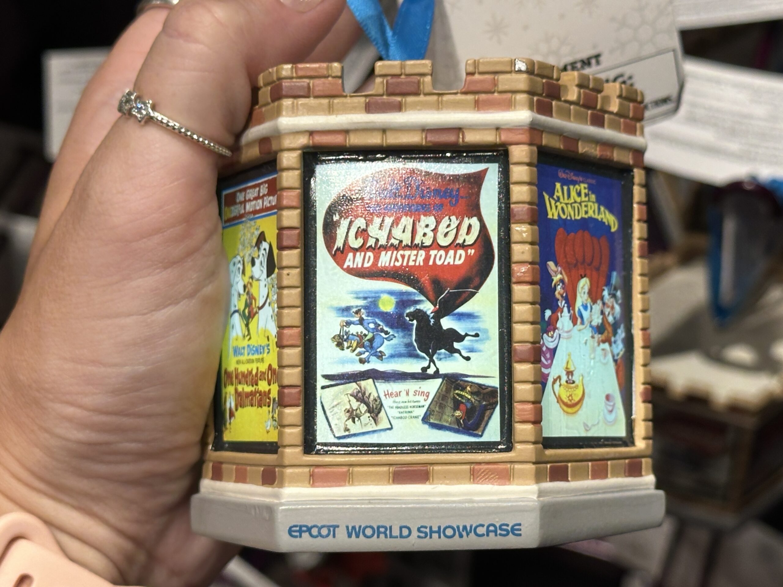 This six-sided, light-up ornament celebrates classic Disney films that took place in England. Each side has a different vintage poster from the film. These include Peter Pan, The Sword in the Stone, One Hundred and One Dalmatians, Icabod and Mister Toad, Alice in Wonderland, and Robin Hood.