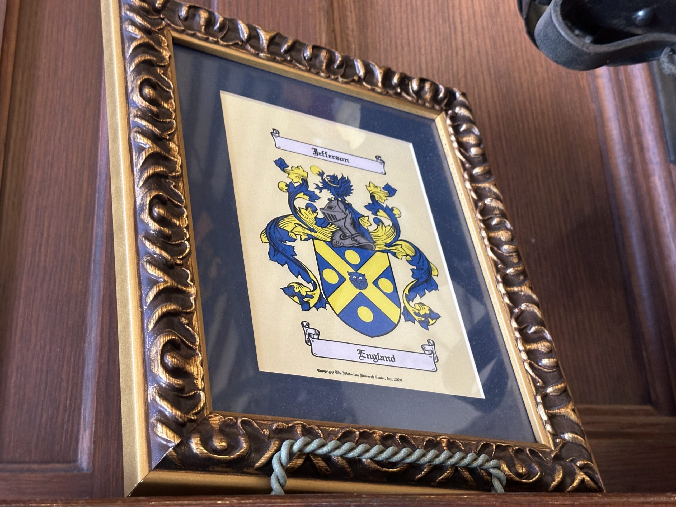 Thomas Jefferson is referenced with the Jefferson family crest from England. Jefferson was a Founding Father and the third president of the United States. He was the primary author of the Declaration of Independence.