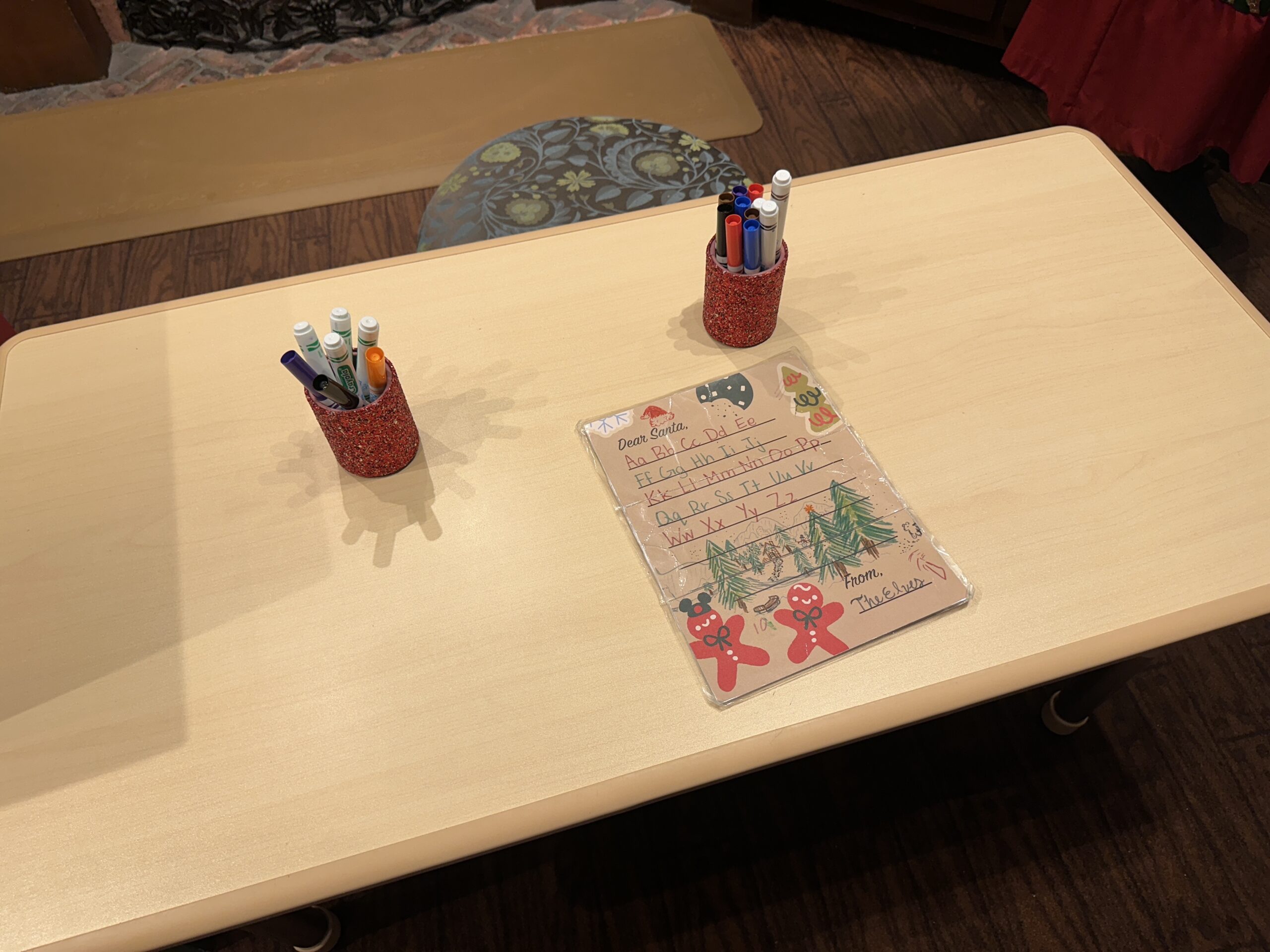 At the station, letter writers can write a letter to Santa with their wishes for the holidays. The paper is gingerbread colored with two little gingerbread men on the bottom, one of which is wearing a Mickey ear hat. Once the letter is written, it can be placed in the nearby mailbox for delivery to the big man in red himself.