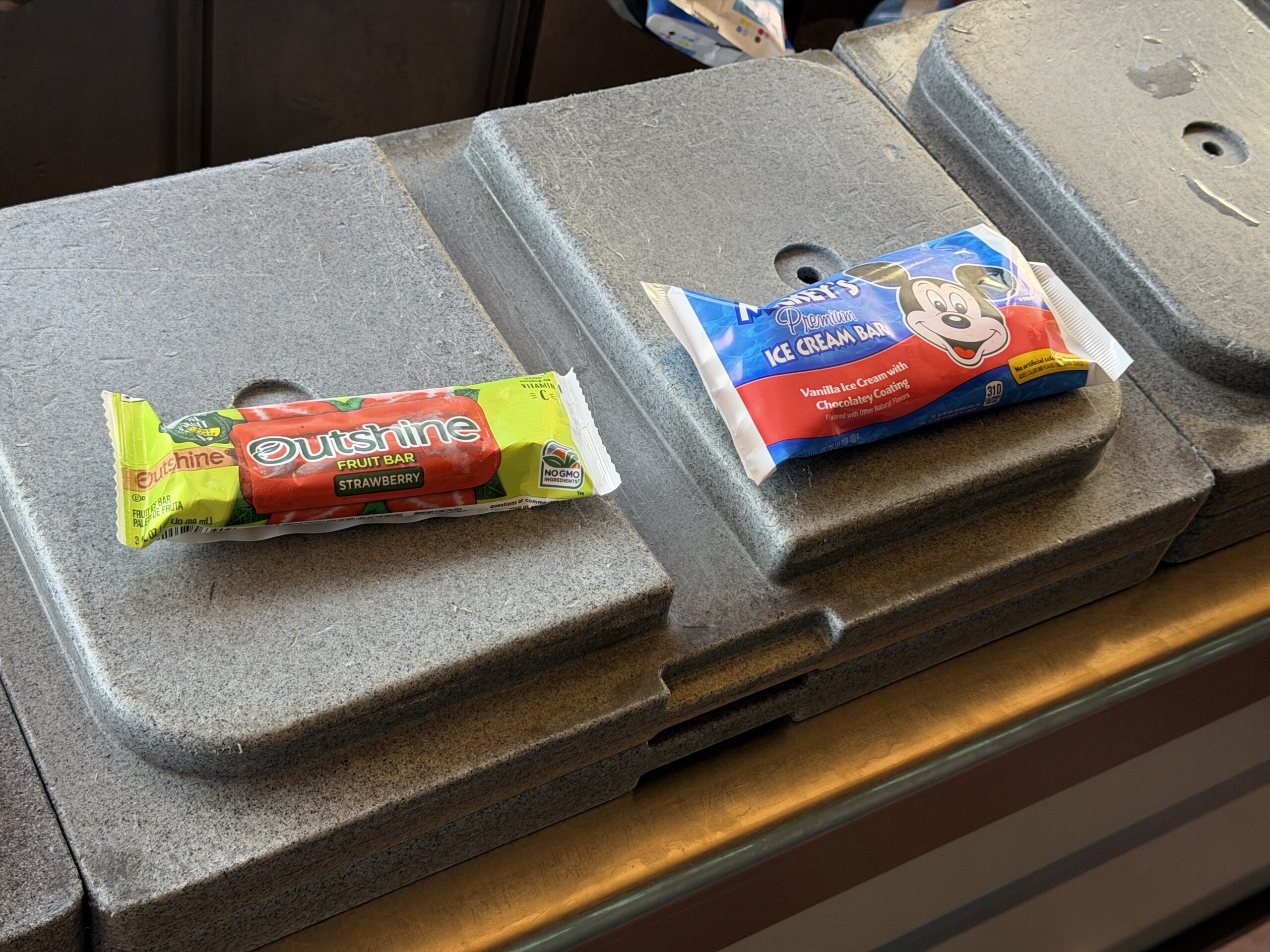 In addition to the license plate, during our visit yesterday, July 17, we were also given a choice between a free Outshine fruit bar or a Mickey ice cream bar on our way out of the line.