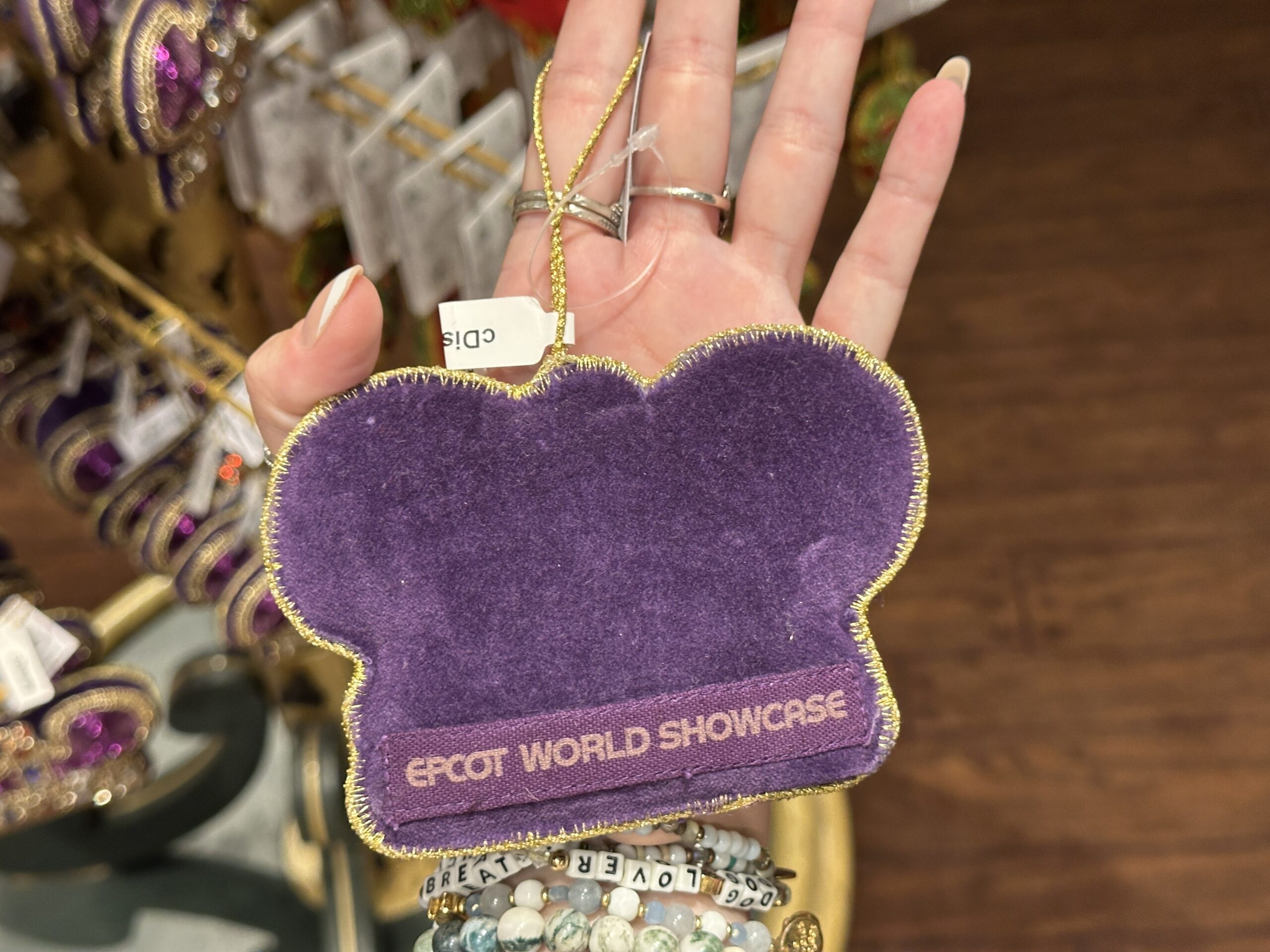 The back of the ornament is plain except for a patch on the bottom which reads "EPCOT World Showcase."