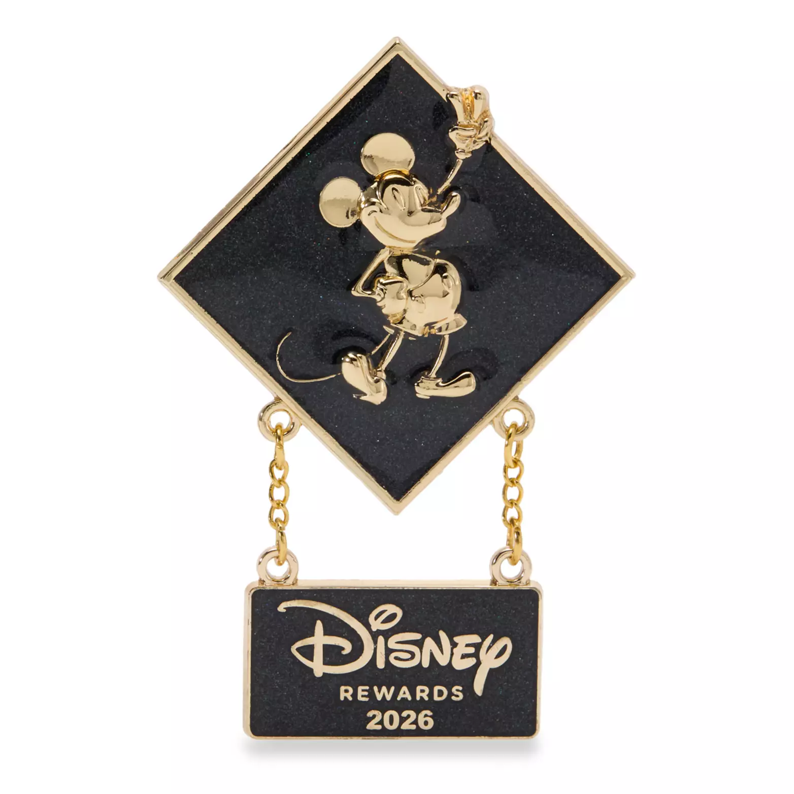 This limited release Disney Rewards cardholder pin features gold-toned Mickey against a shiny black background. He is in the center of a diamond shape. A hanging charm beneath says “Disney Rewards 2026.” The backer of this pin looks like a Disney Rewards Visa card.