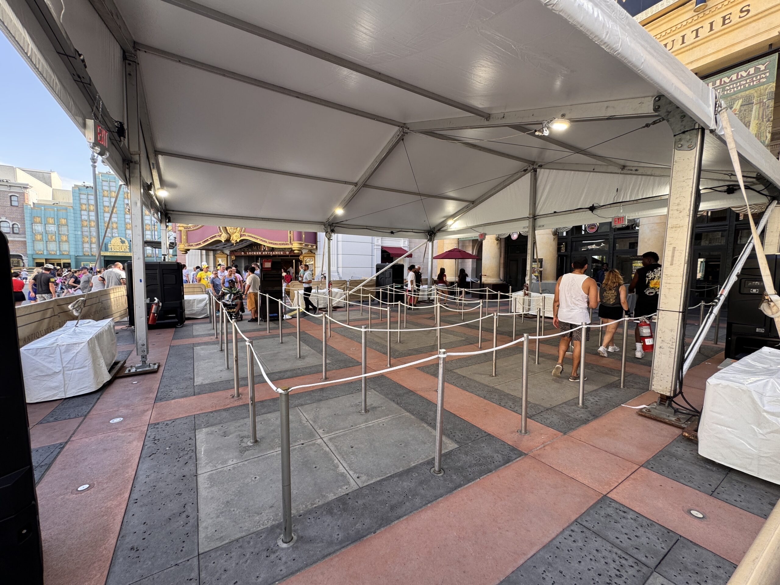 The covered queue could be related to the Halloween Horror Nights Tribute Store. Last year, the themed store took over the Sahara Traders gift shop and adjacent arcade. In the past, it has used the ride's extended queue building.