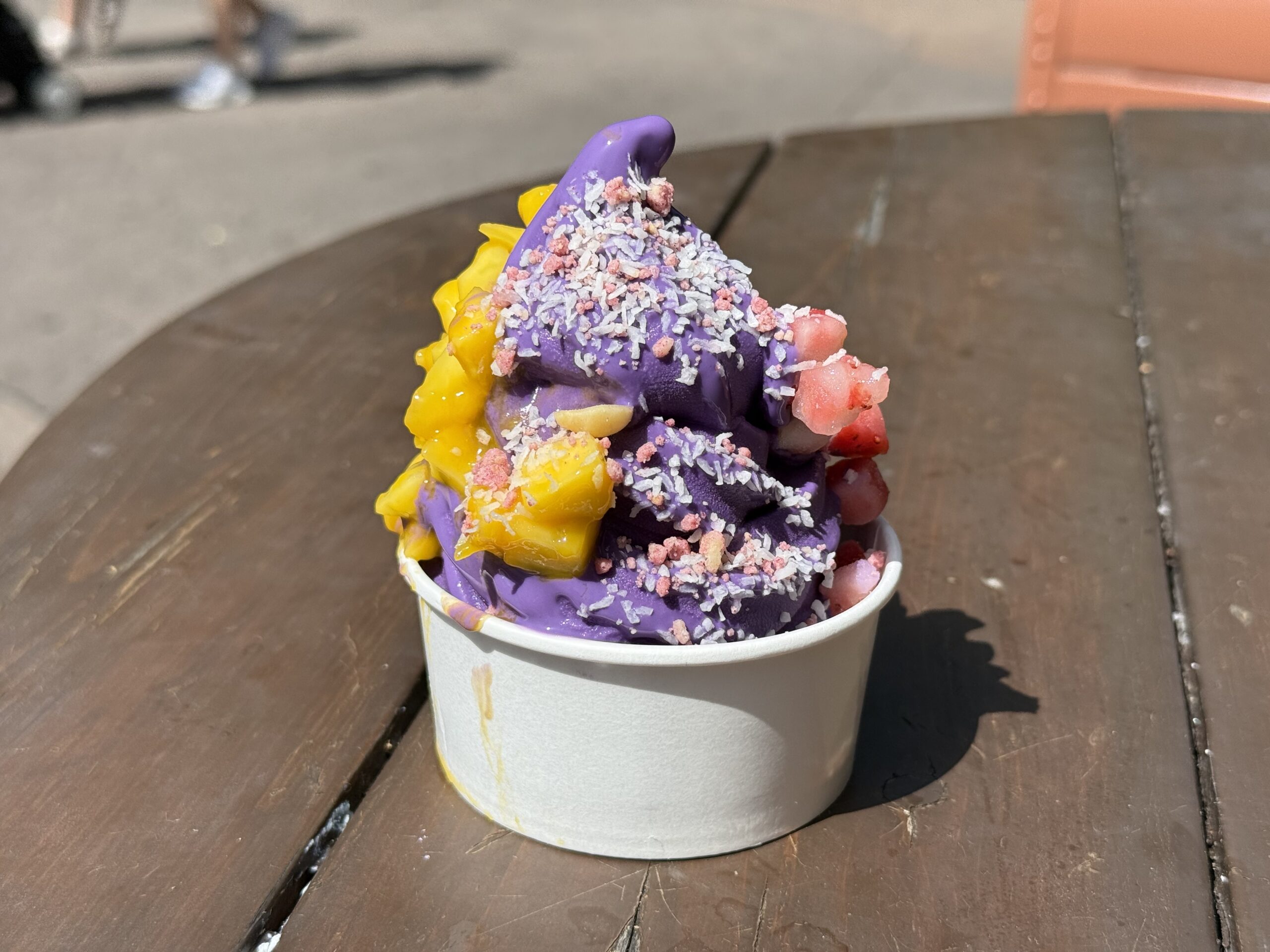 The ube ice cream is very sweet, but it is perfectly accented by the macadamia nut and coconut shavings, and the very fresh fruit. This is one of the best soft serve ice cream flavors I’ve had at Walt Disney World, my personal favorite.