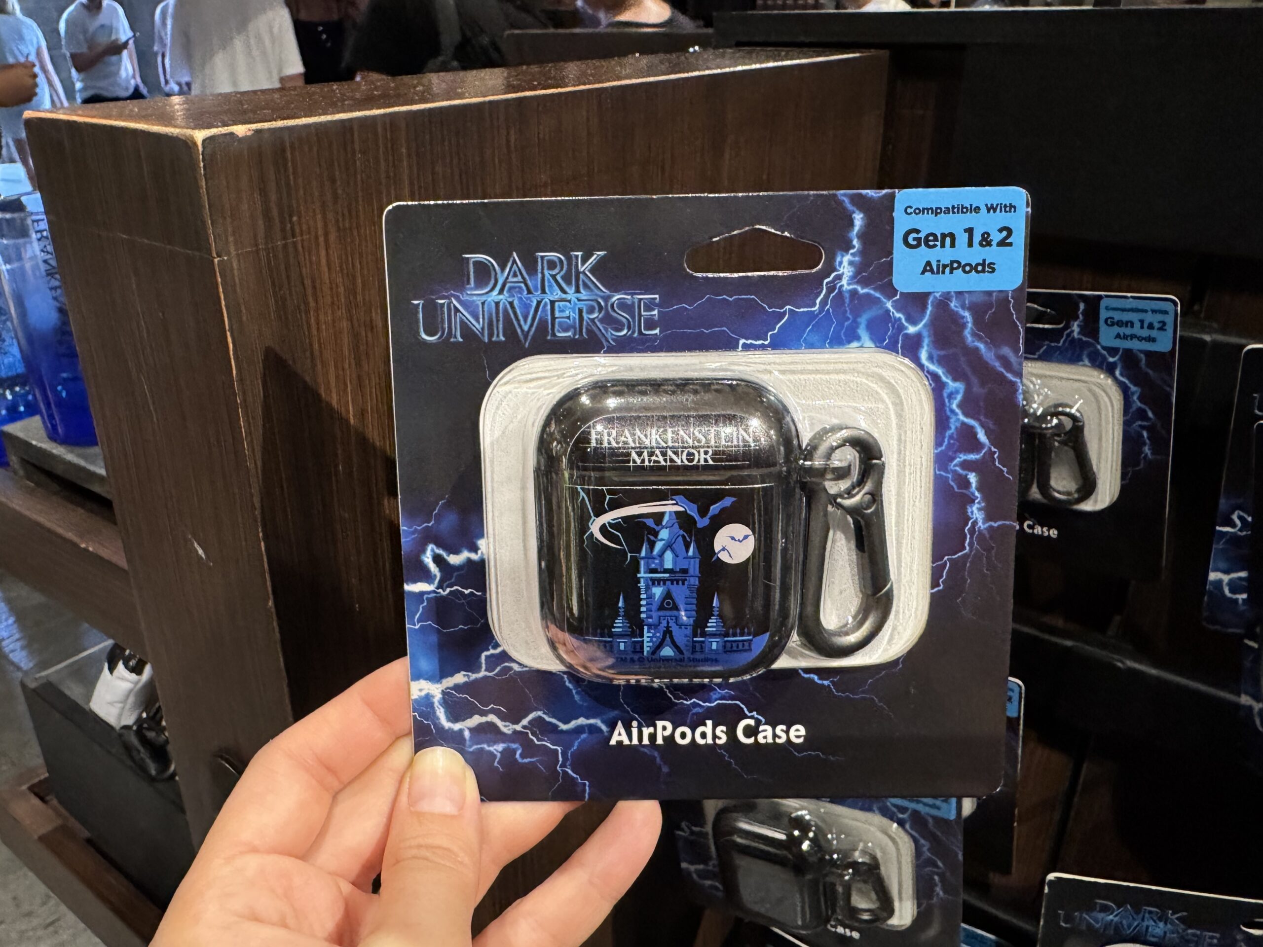 There are multiple versions of the AirPods case for Gen 1 and 2 AirPods Pro and Gen 4 AirPods. All three styles feature the towers of Frankenstein Manor in blue with bats flying across the sky and moon. "Frankenstein Manor" is in white on the lid.