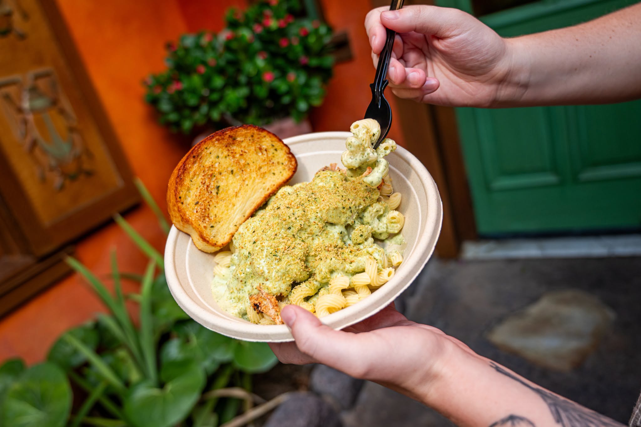 Creamy Pesto Chicken Pasta for $13.29. It comes topped with toasted garlic bread crumbs and a side of garlic bread.
