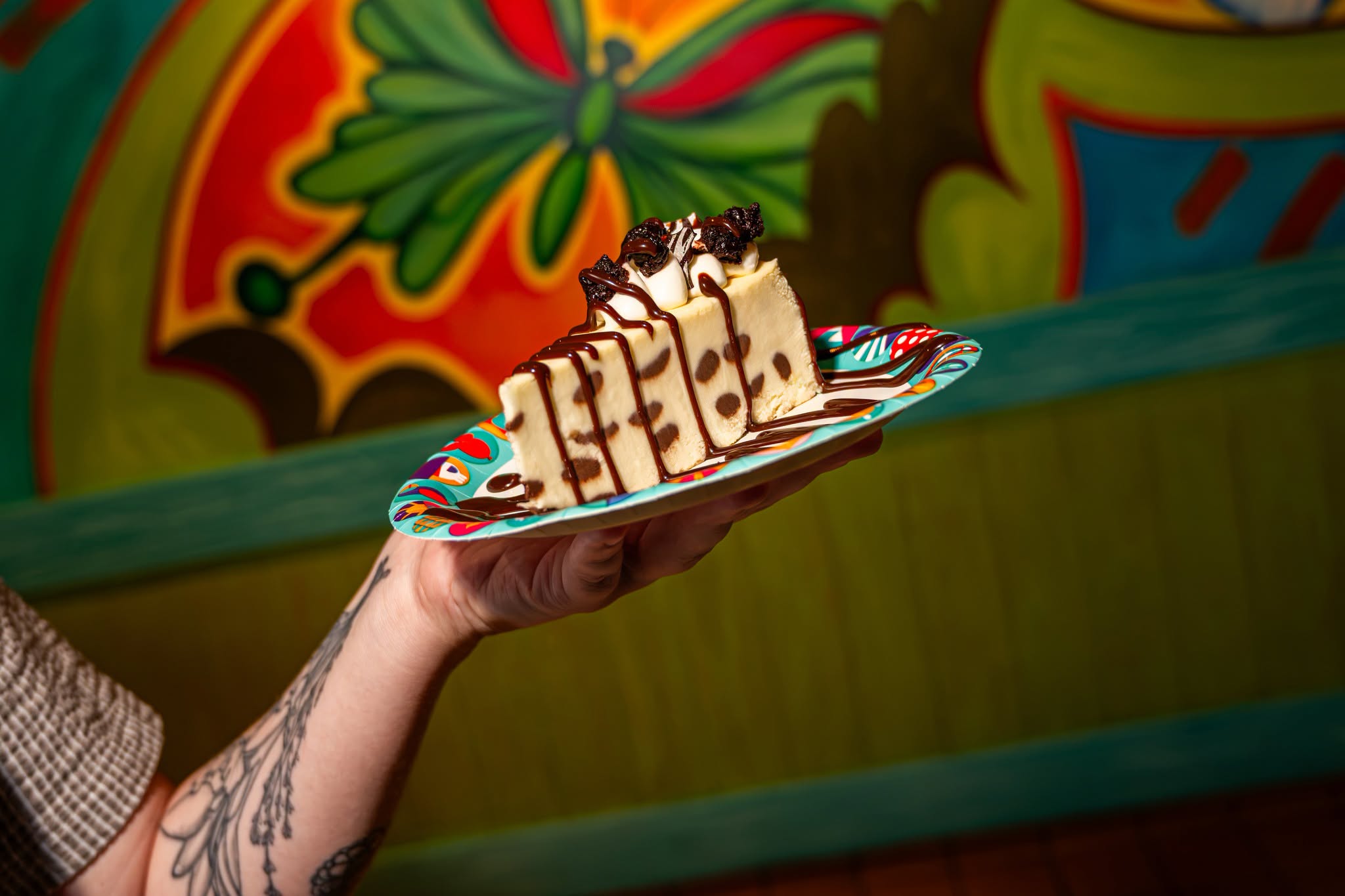 Marble Swirled Cheesecake with Vanilla Whipped Cream, Chocolate Sauce, Mini Brownies, and Chocolate Zebra Stripes for $6.49.