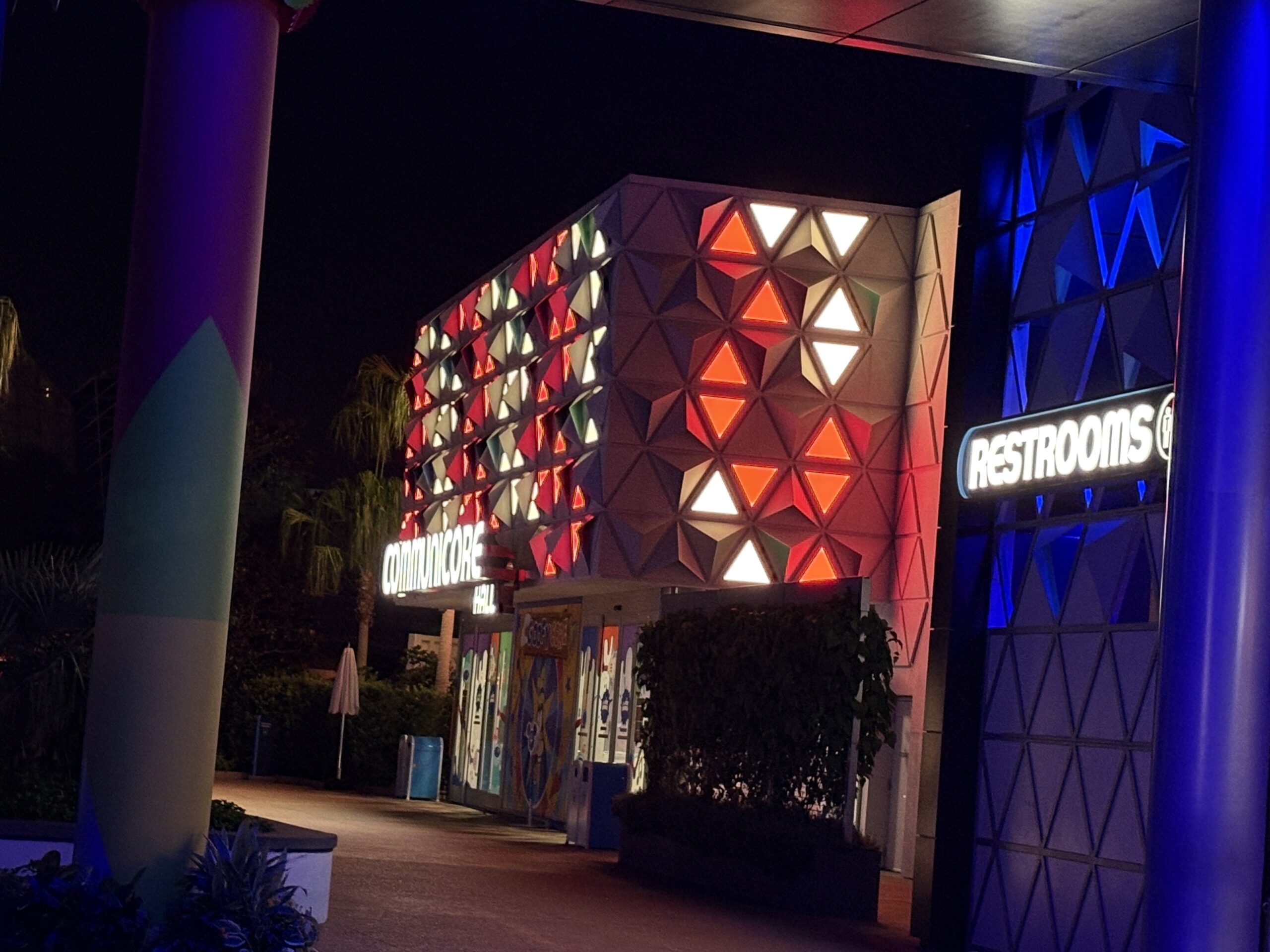 EPCOT has some patriotic lighting in place for America's 250th birthday this year. Spaceship Earth is decorated like an American flag, and other facades have red, white, and blue lighting.