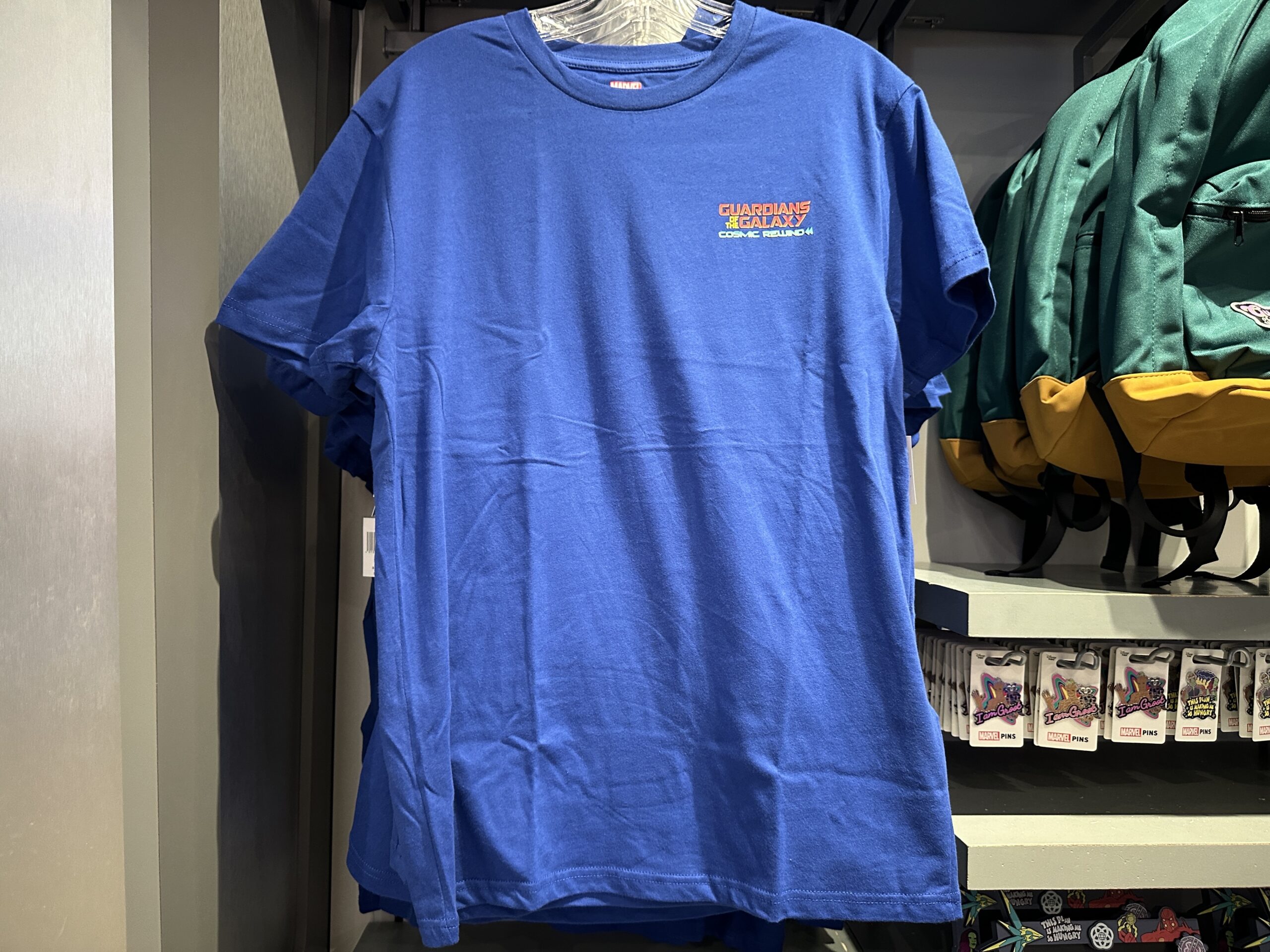 The Guardians of the Galaxy: Cosmic Rewind wordmark is on the left chest of this blue tee.