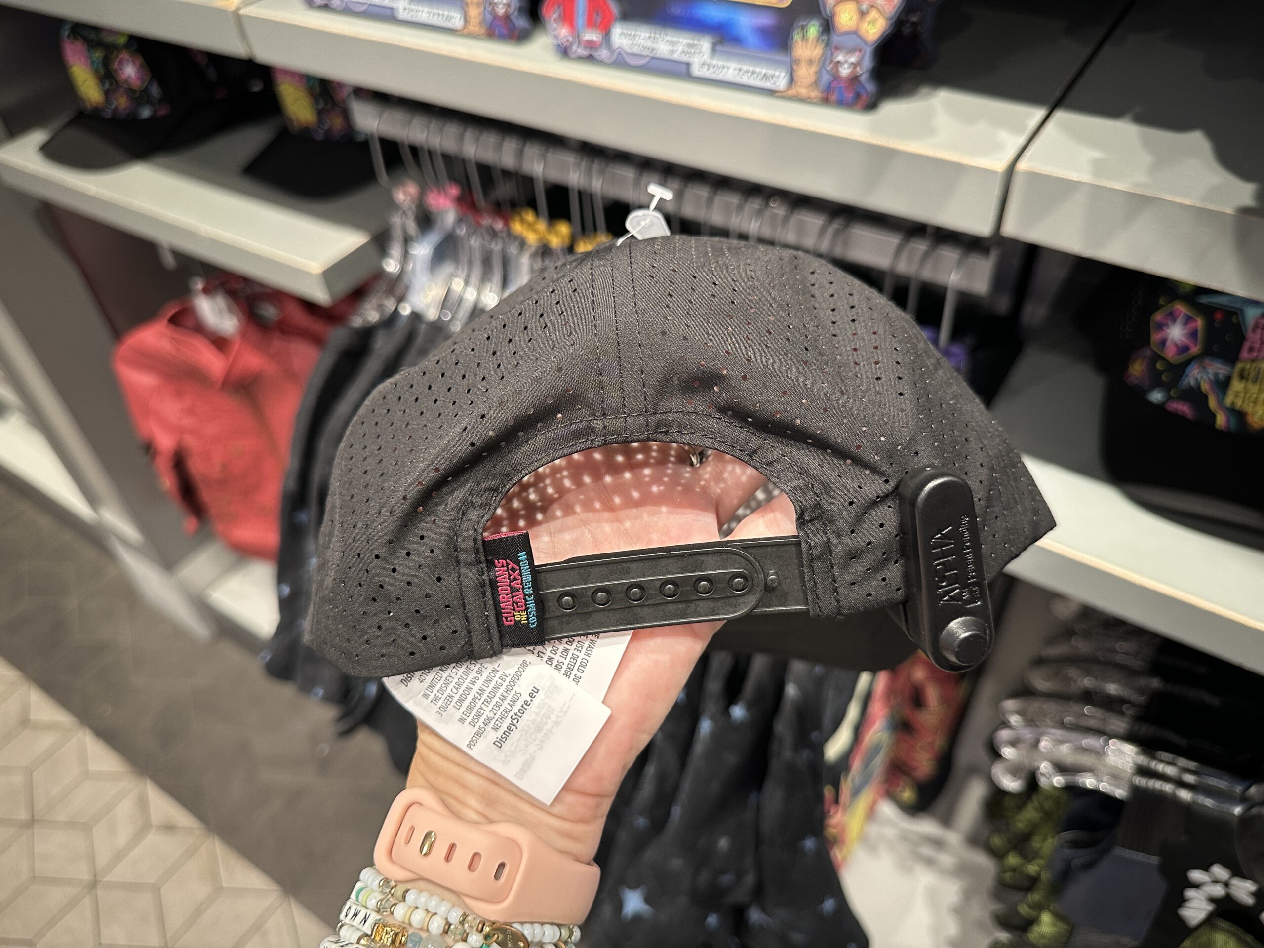 The rest of the cap is black mesh. It has a plastic adjustable strap with a Guardians of the Galaxy: Cosmic Rewind tag.
