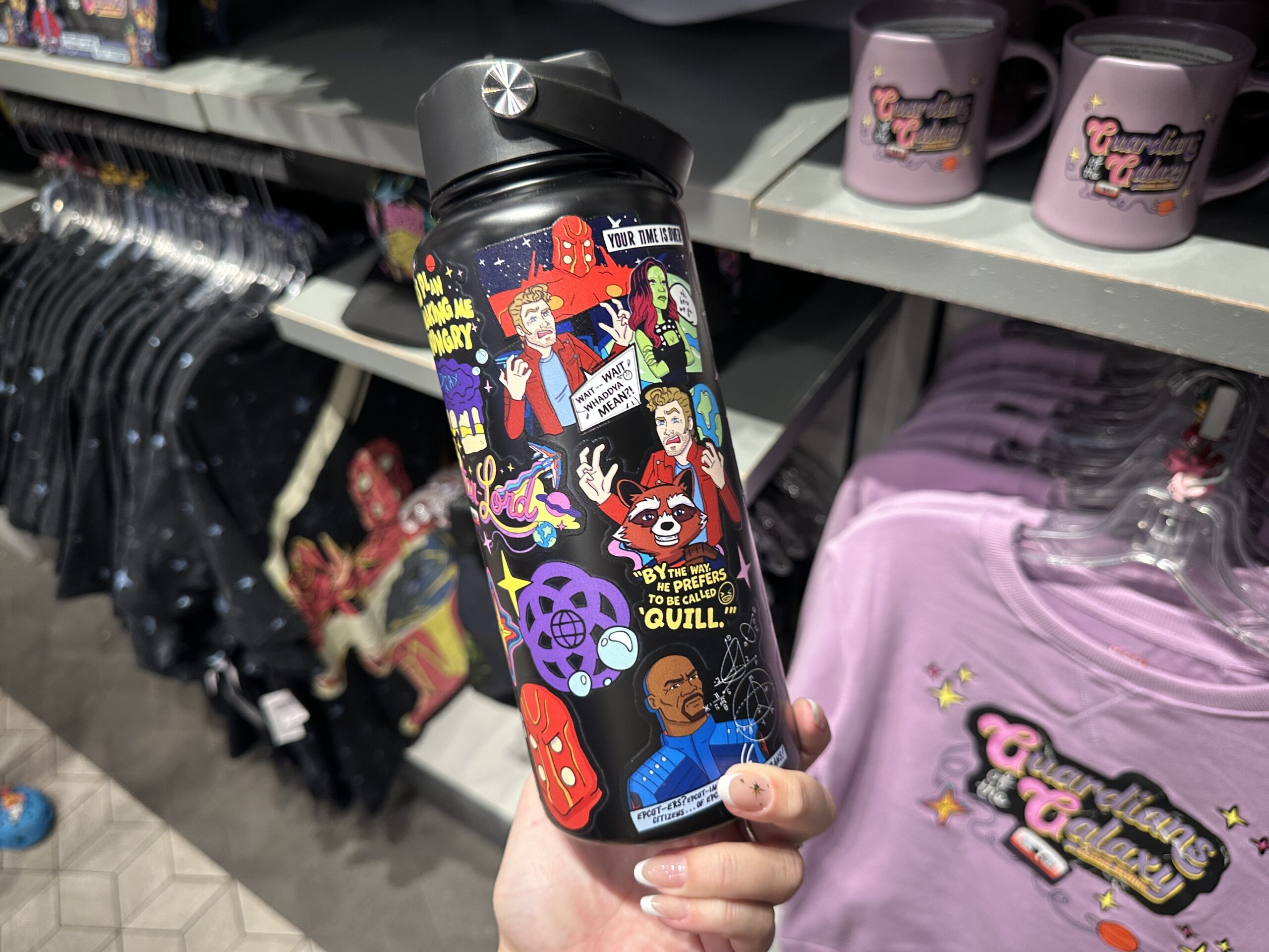This black bottle is covered in "stickers" with the same Scooby Doo-esque art style. They feature the Guardians, Nova Prime, Tal Marik, and other iconography from the attraction.