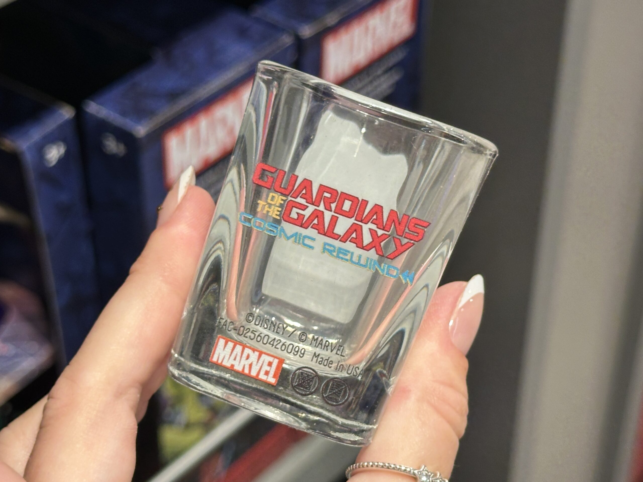 "Guardians of the Galaxy: Cosmic Rewind" is on one side of this squared glass. Tal Marik is on the reverse with geometric diagrams around him and his "EPCOT-ers?" quote below.